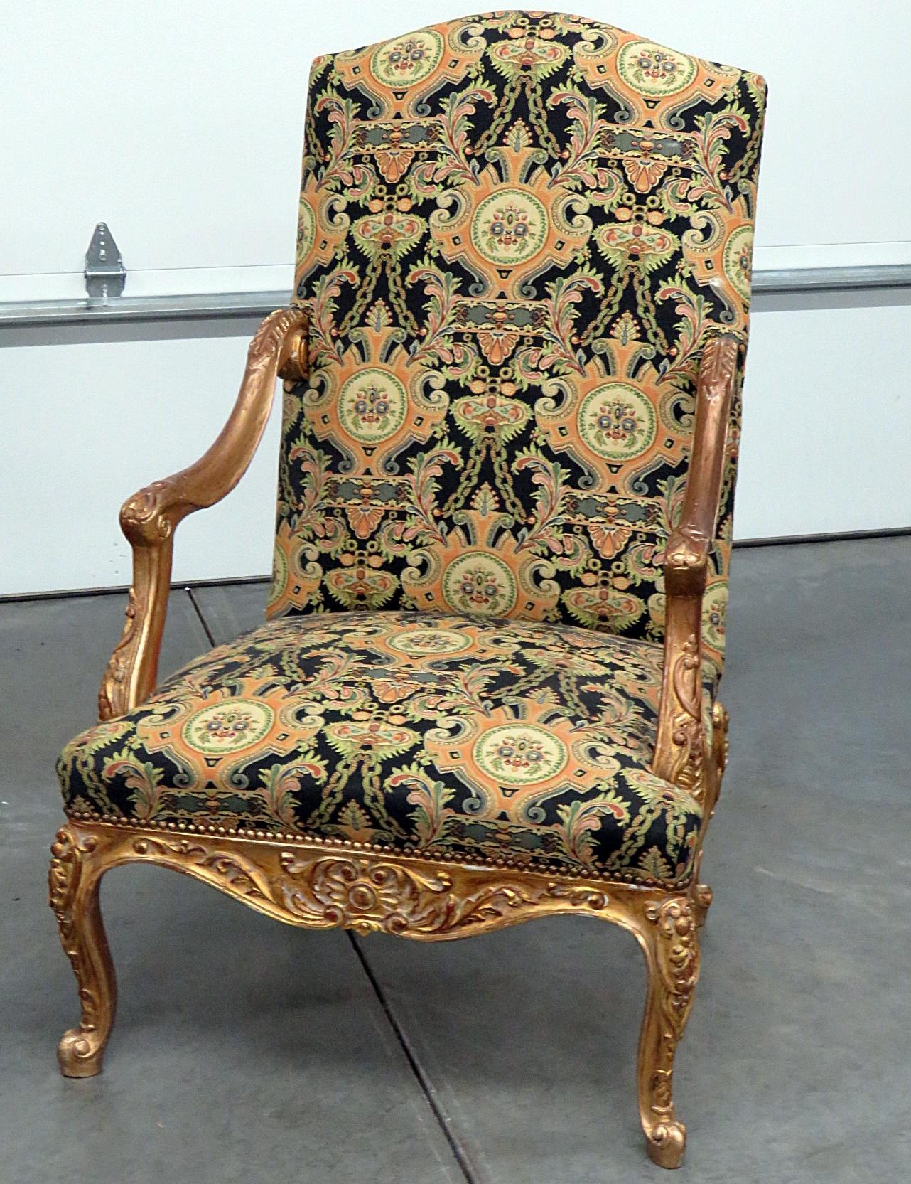 Pair of Louis XVI machine tapestry armchairs with distressed gilt accents.