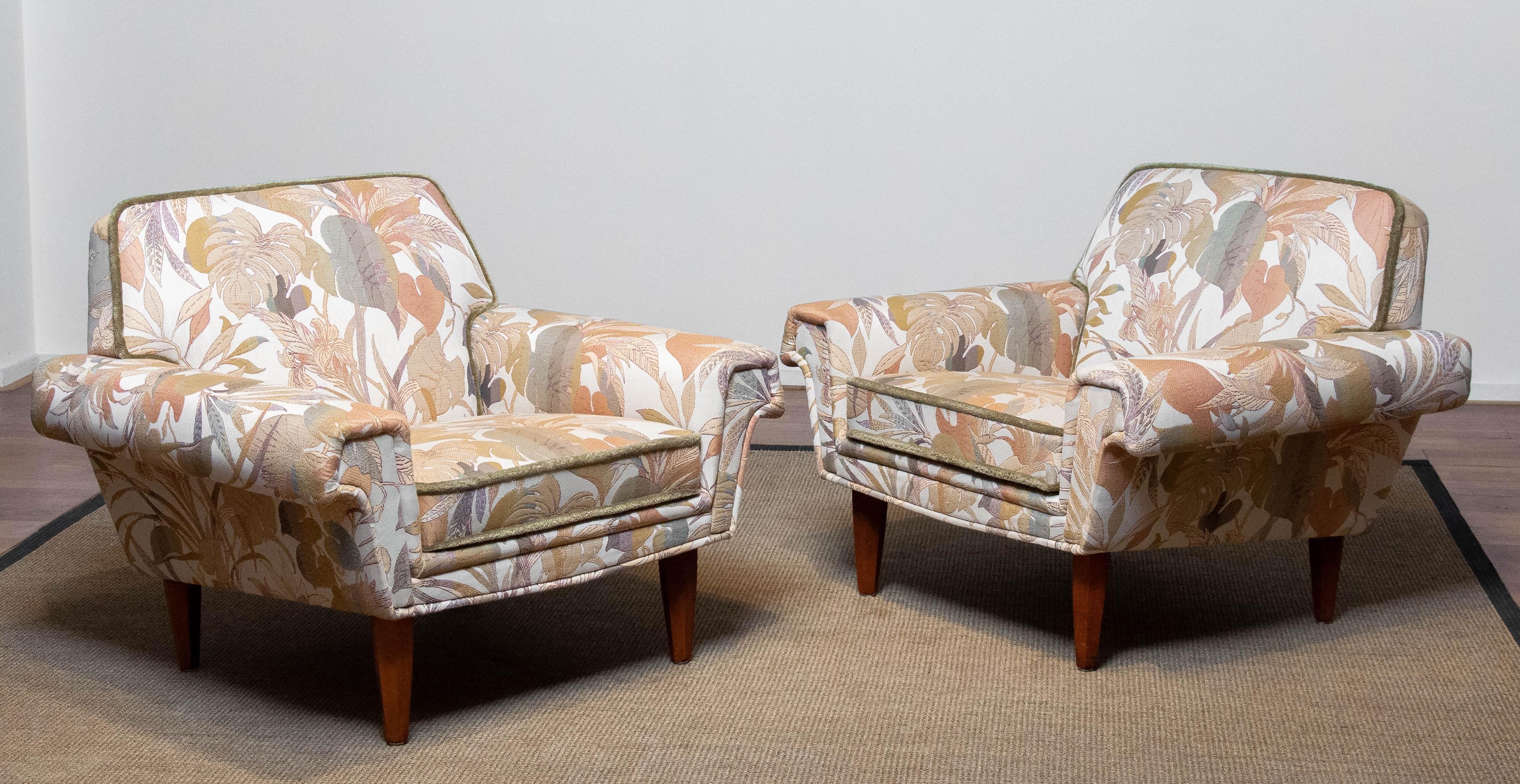 Excellent restored ( in the 1970's ) pair low back lounge / club chairs from Denmark originally from the 1950's and upholstered with superior quality and beautiful multi colored Jacquard fabric. Both chairs are in absolutely great and clean