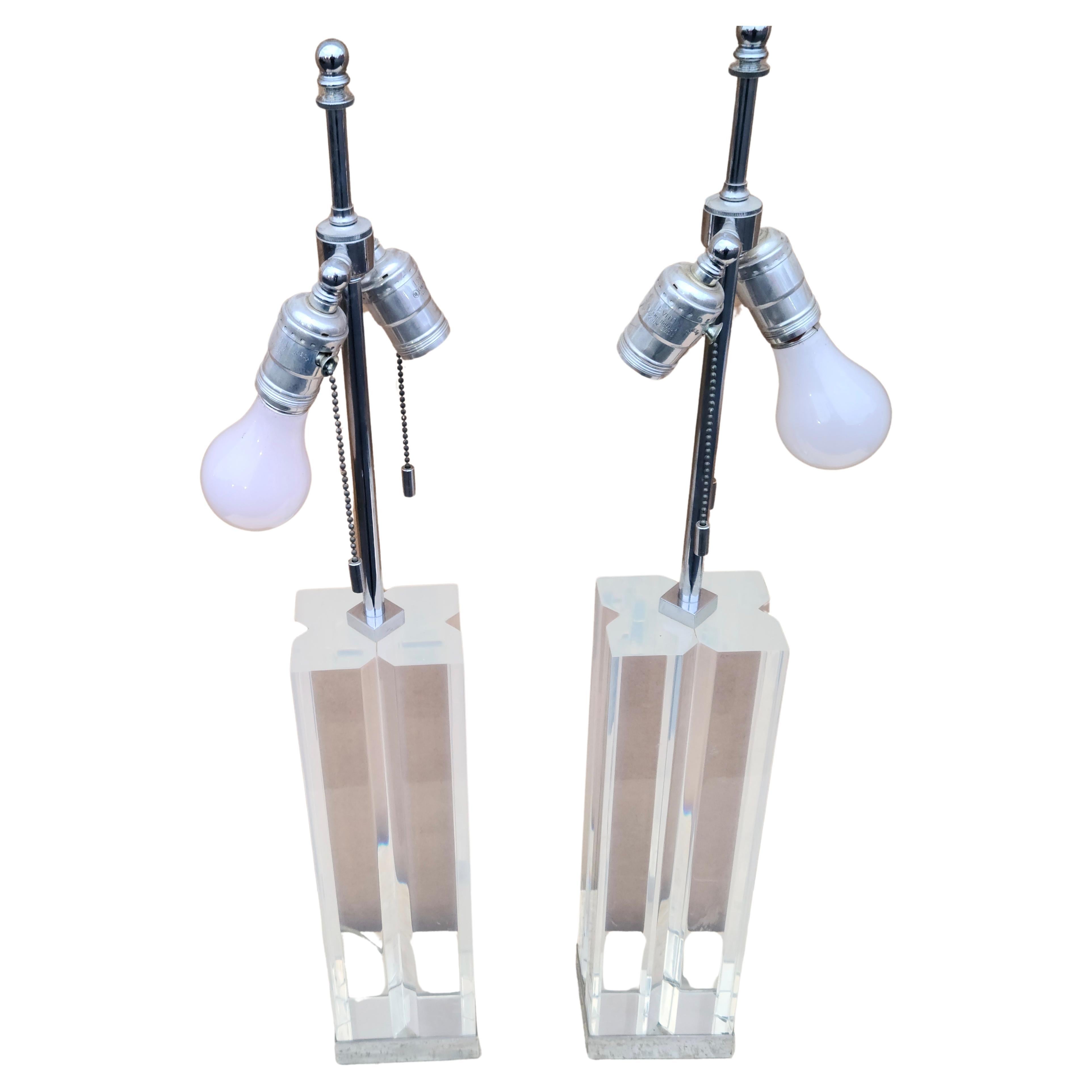 Pair Lucite and Chrome Lamps signed Hansen New York.

Designed by Karl Springer.

Lucite and Chrome construction.