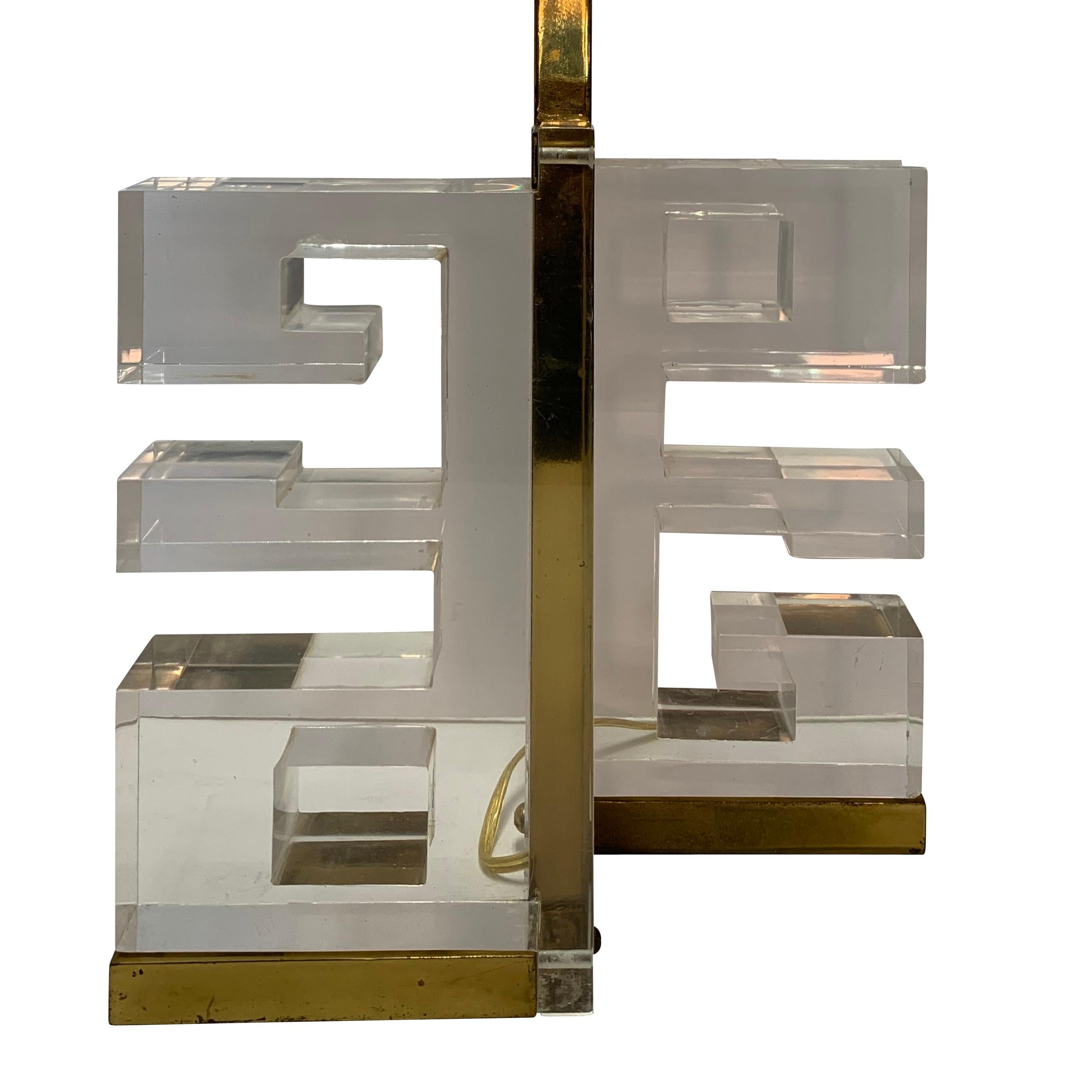 1950s Italian pair of Lucite and brass Greek key design lamps
Base measures: 11