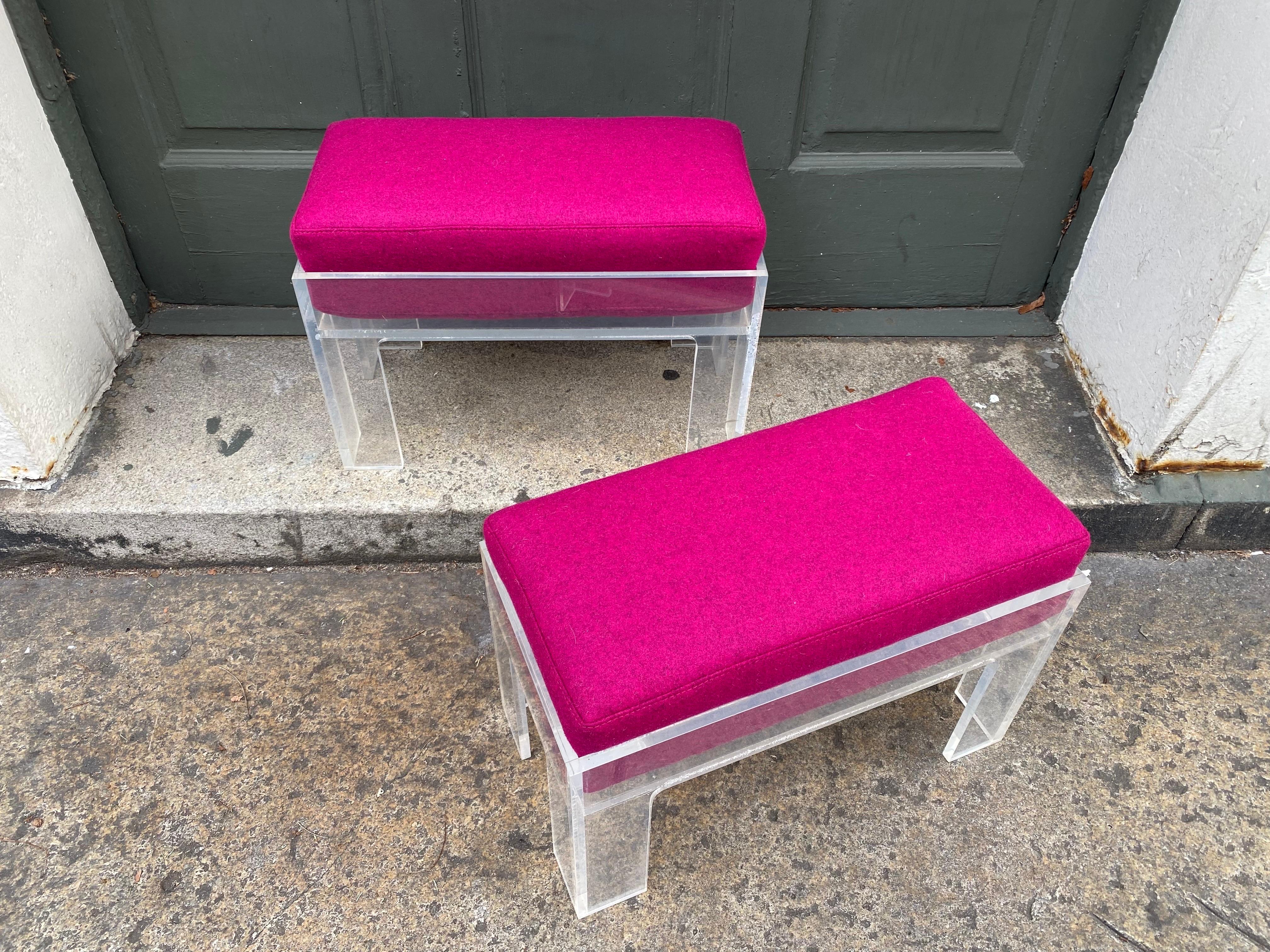 Pair of Lucite Ottomans with Pink Cushions.  Little punch of color to shake and wake up that room!  Newly upholstered cushions.
