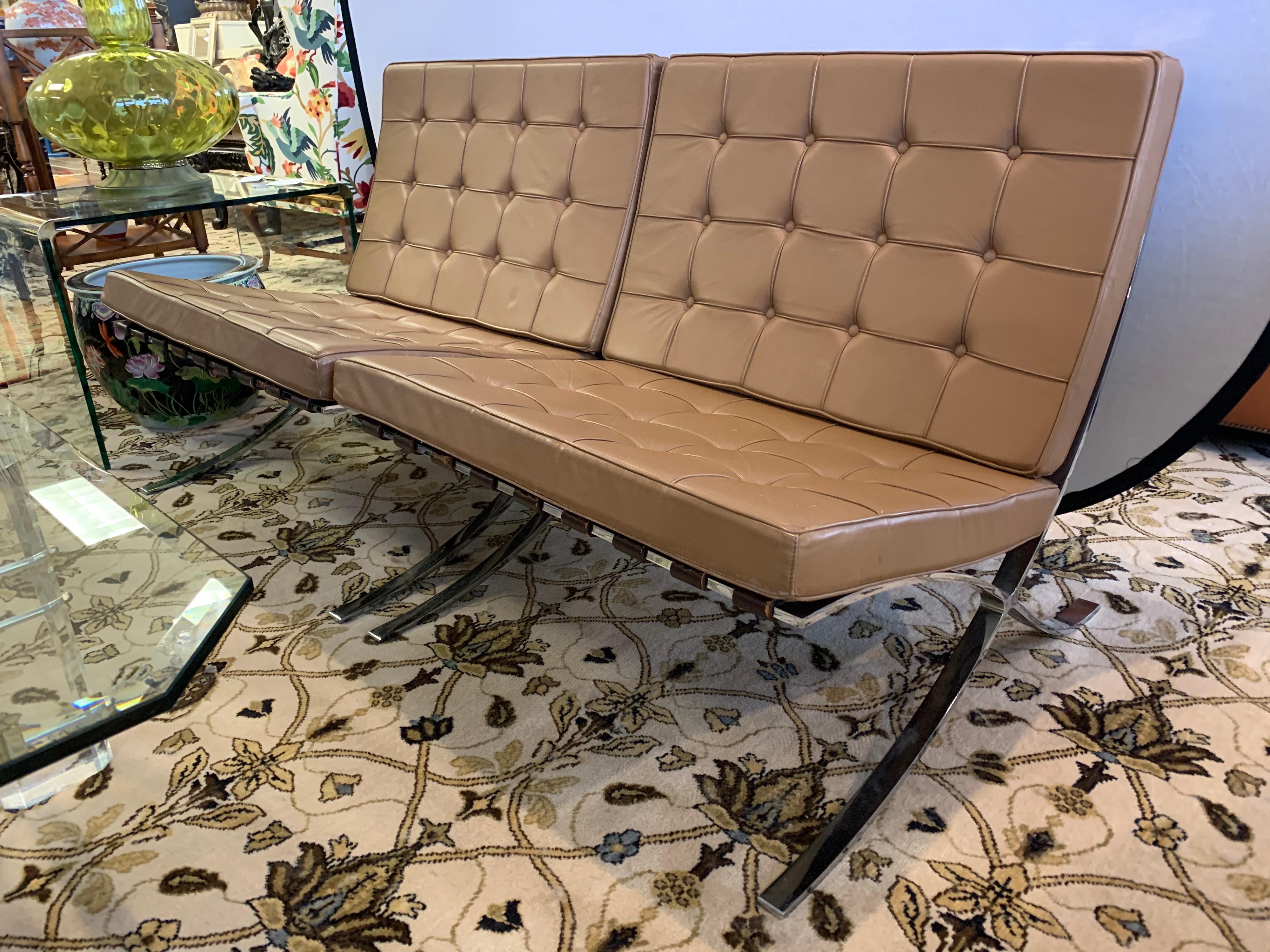 Pair of unsigned vintage light brown leather Barcelona chairs, circa 1970s and made in USA.
Condition of leather is very good. One repair under seat, hidden unless chair is upside down. See pics.