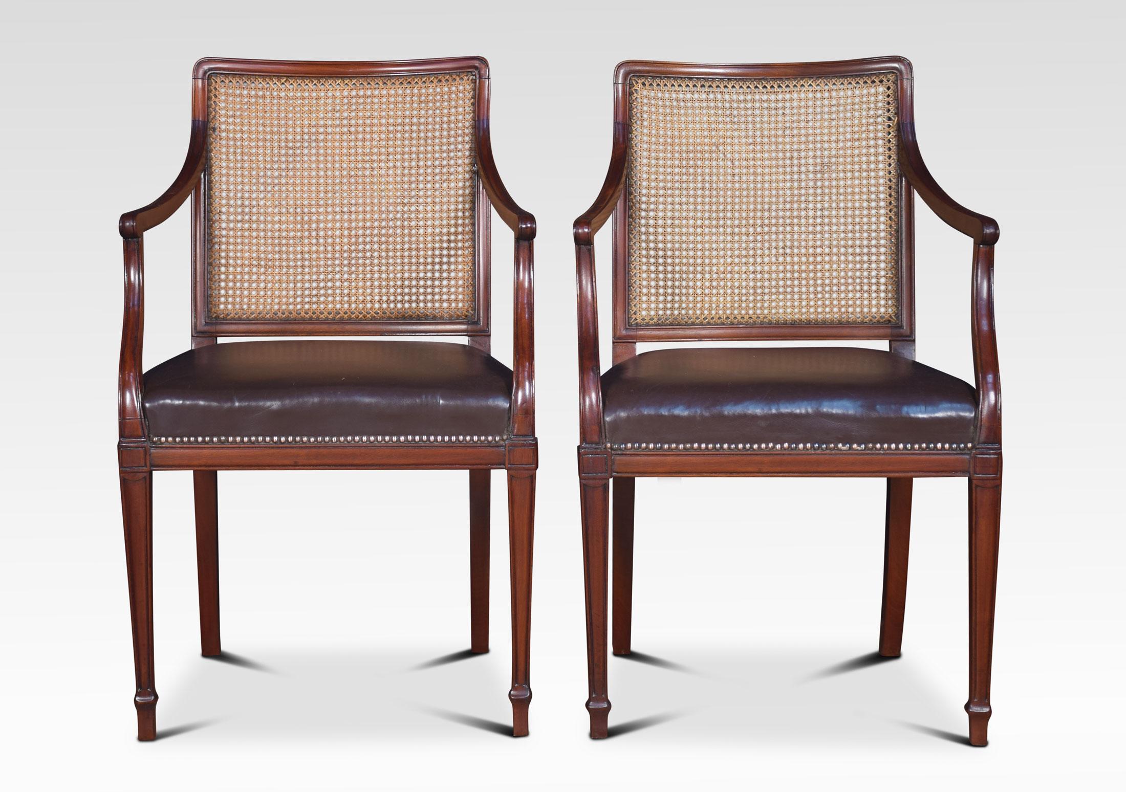 Pair mahogany Hepplewhite style office armchairs having square bergere backs above close nailed leather upholstered seats. All raised up on square tapering legs and spade feet.
Dimensions
Height 37 inches height to seat 20 inches
Width 23