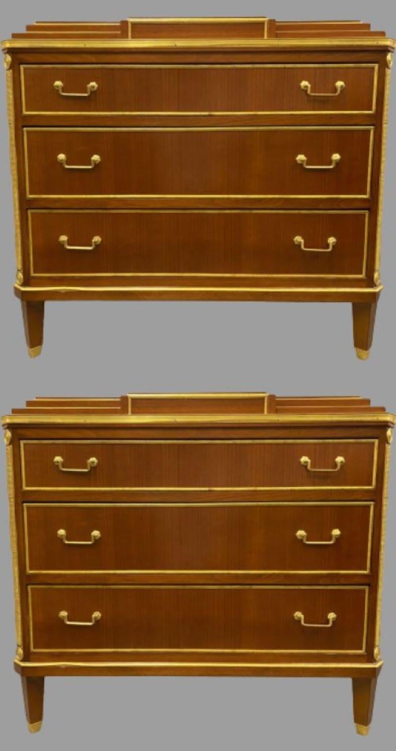 Pair of mahogany double step up Russian neoclassical style commodes. Each of these custom quality commodes have fine polished mahogany finishes decorated with bronze mounts. The tapering legs with bronze sabots support a three drawer bronze framed