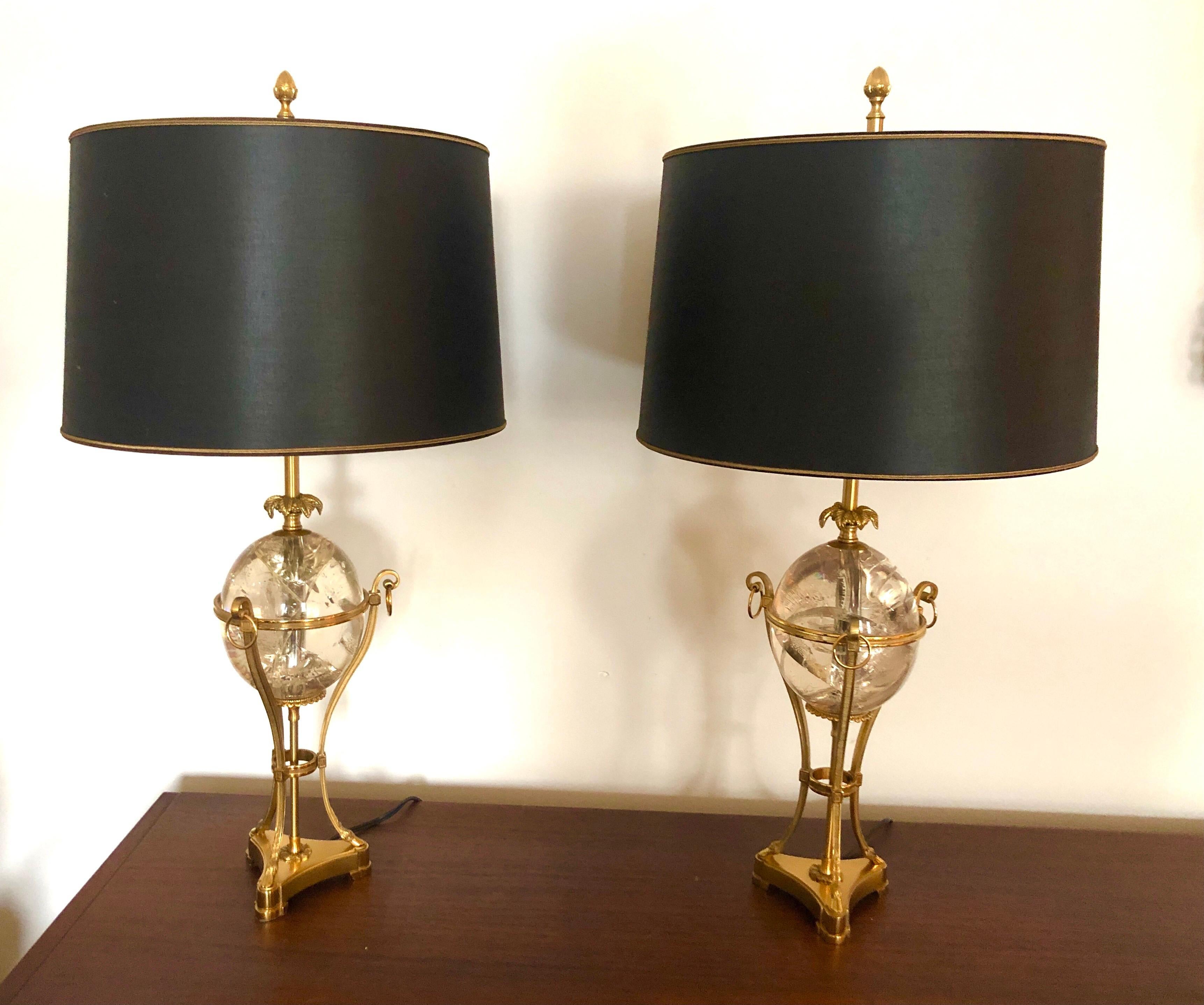 C. 1960s, France, the Louis XVI cassoulet-form table lamps in gold-plated bronze supporting a clear fractal resin orb. Triple-cluster socket with one way switch on the cord. Stamped “Charles Made in France” to base. With original black and gold