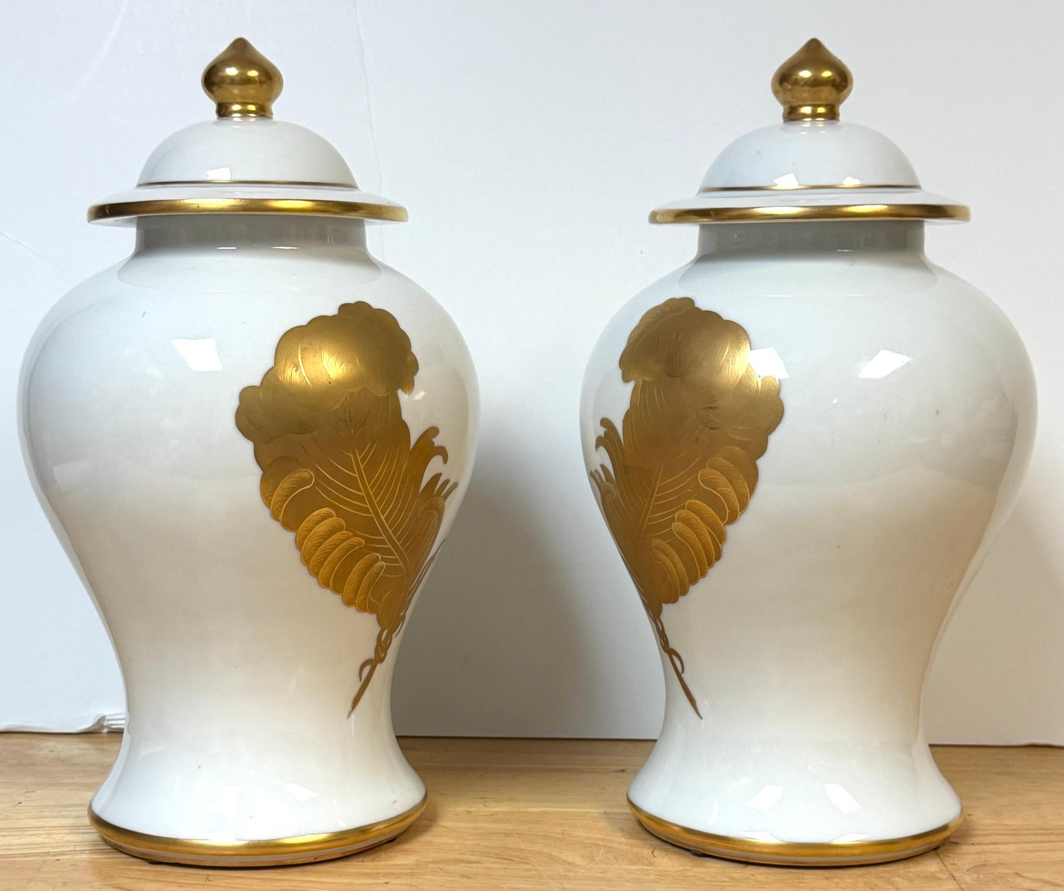 Enameled Pair Maison Jansen Style Porcelaine de Paris Covered Urns Gilt Feather Motif For Sale