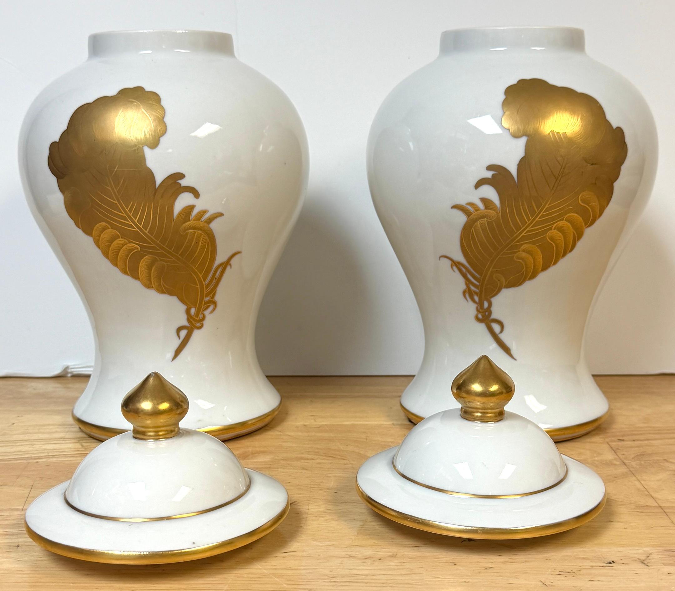 20th Century Pair Maison Jansen Style Porcelaine de Paris Covered Urns Gilt Feather Motif For Sale
