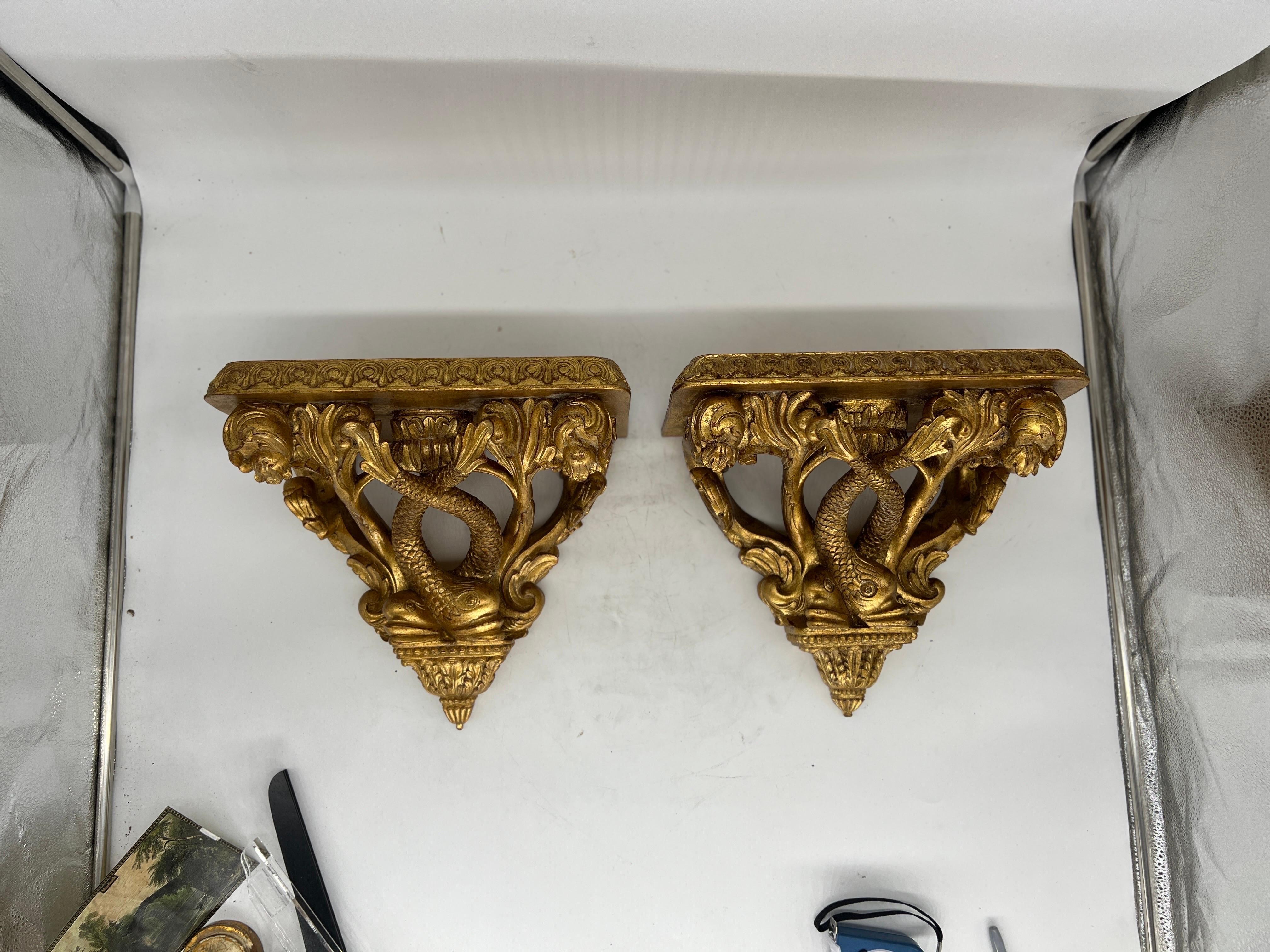 Pair, Maitland Smith Regency Style Gilt Decorated Dolphin Form Wall Brackets

Each bracket has an excellent regency style appearance with gilt dolphin supports. Marked to verso. 