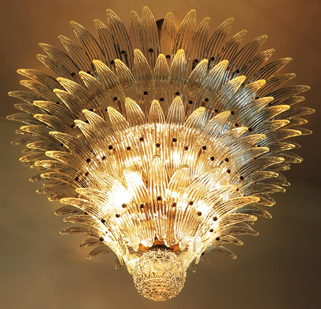 Pair of Palmette ceiling lights - four levels, 163 transparent glasses
Palmette ceiling light made by 163 Murano transparent glasses in a gold metal frame. Murano blown glass in a traditional way. Structure in gold colored metal.
Period: