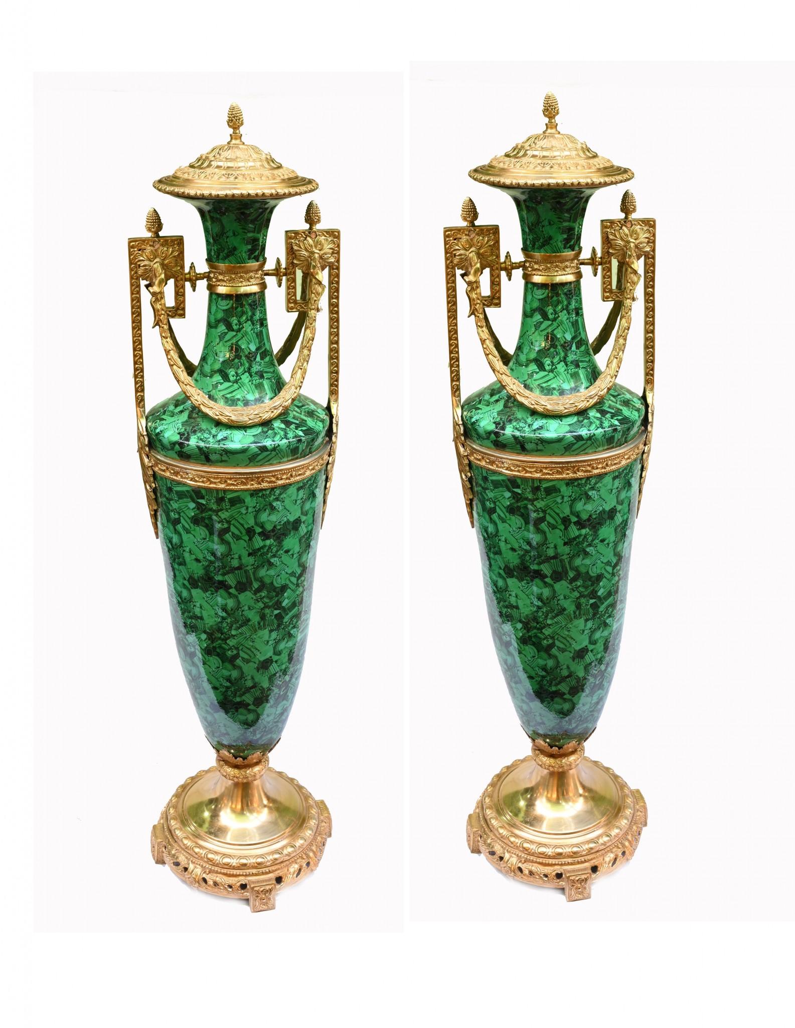 Stunning pair of large French urns in porcelain with a malachite decoration
Good size at over four feet tall - 134 CM - and of classic amphora form
Gilt fixtures are original and with great finish and patina Highly decorative pair ready to elevate
