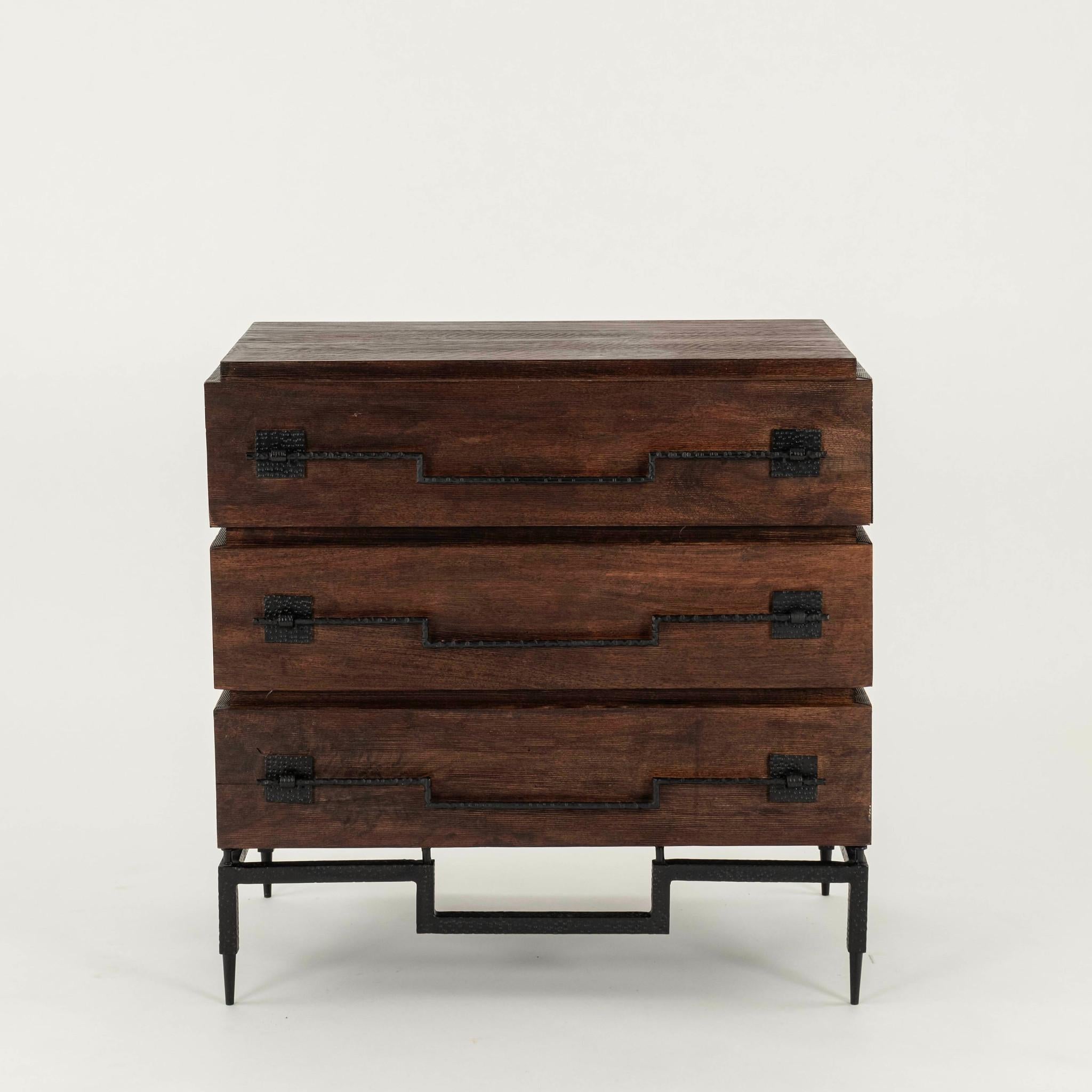 Pair of handsome mango hardwood three drawer chests in a rich dark brown finish with wrought iron base and long hardware pulls.