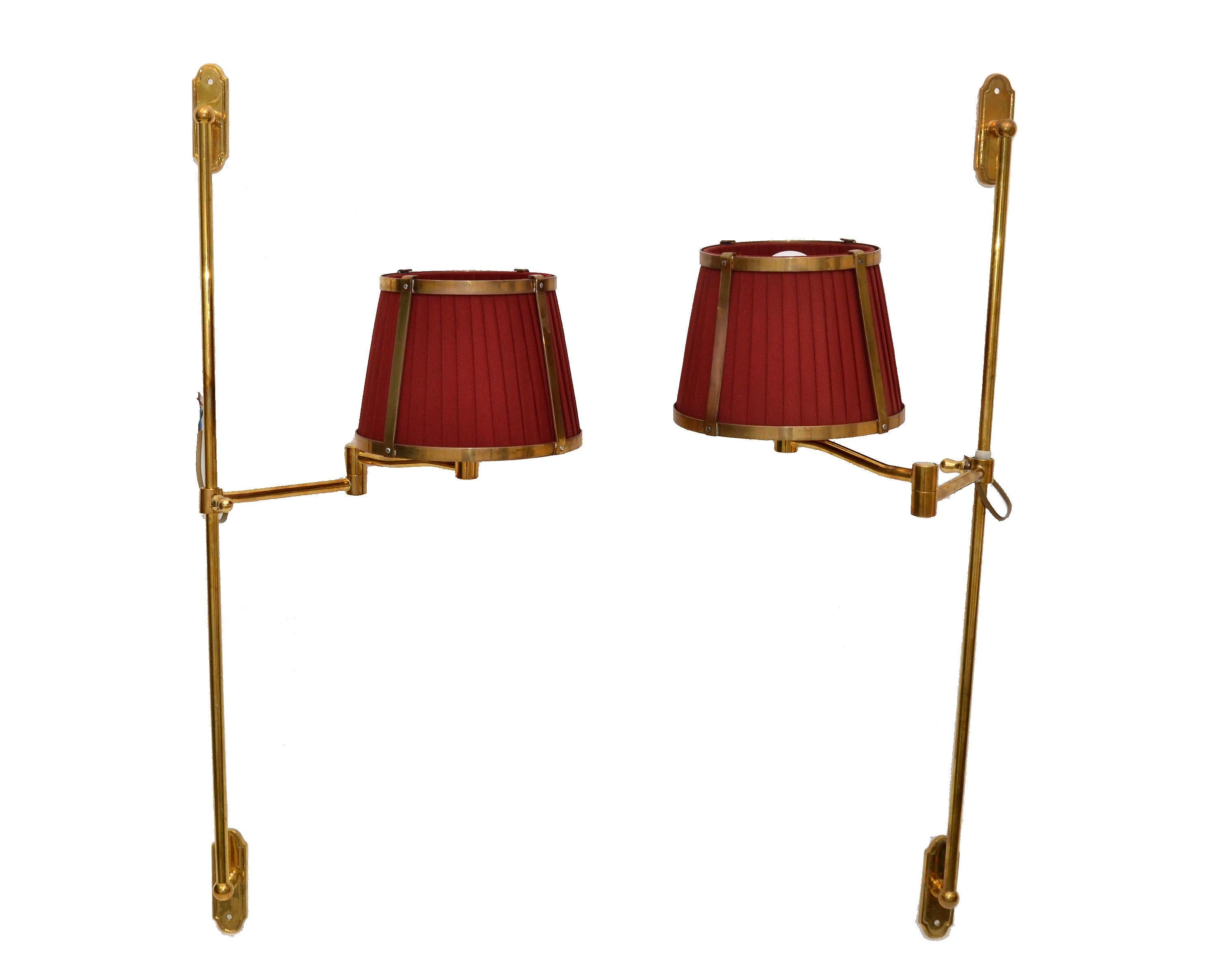 Superb pair of Mid-Century Modern Marina retractable sconces with the original brass & fabric shades.
Marked Marina at the socket.
Shade measures:
Top Diameter: 6.5 inches
Bottom Diameter: 8.25 inches
Height: 6.13 inches.


 