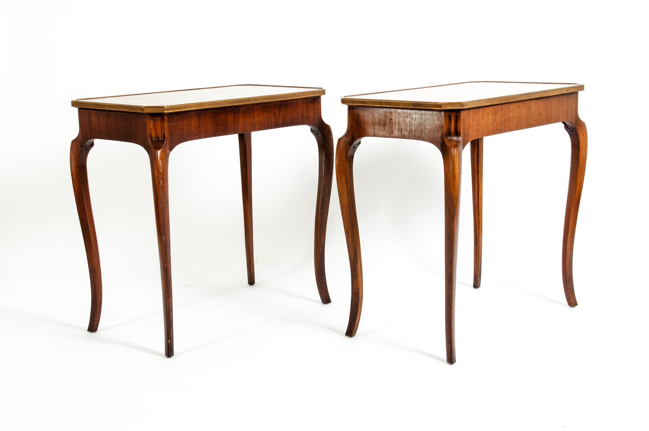Pair of mahogany marquetry style end / side table. Each table is in excellent vintage condition. Minor wear consistent age / use. Each table measure stand about 27 inches L x 16 inches W x 26 inches H.