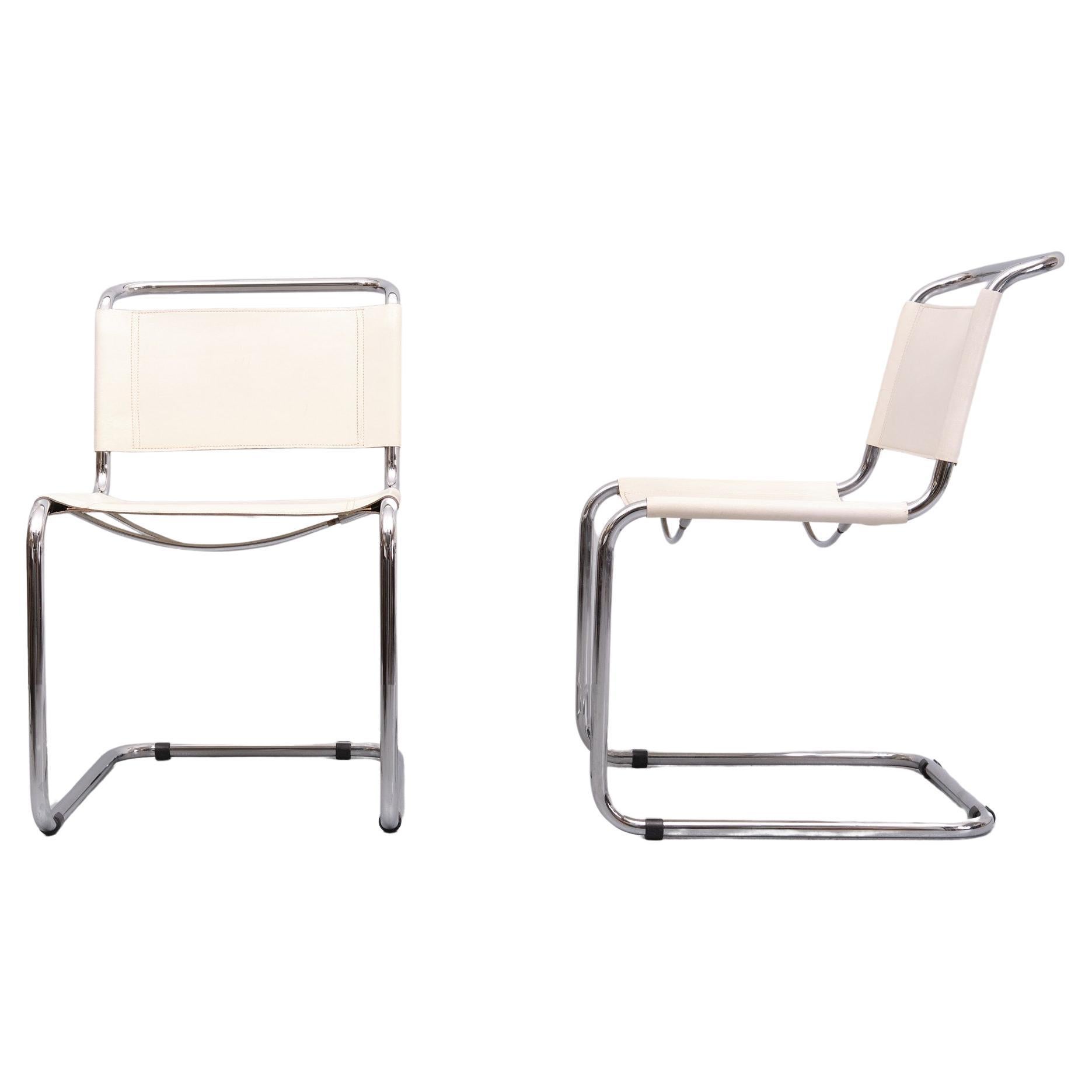 Two Original White Leather cantilever chair . Chrome Tube frame.  1970s 
Pioneering Dutch modernist architect-designer Mart Stam (1899-1966) was a famous proponent for New Objectivity, a German cultural movement advocating for a return to