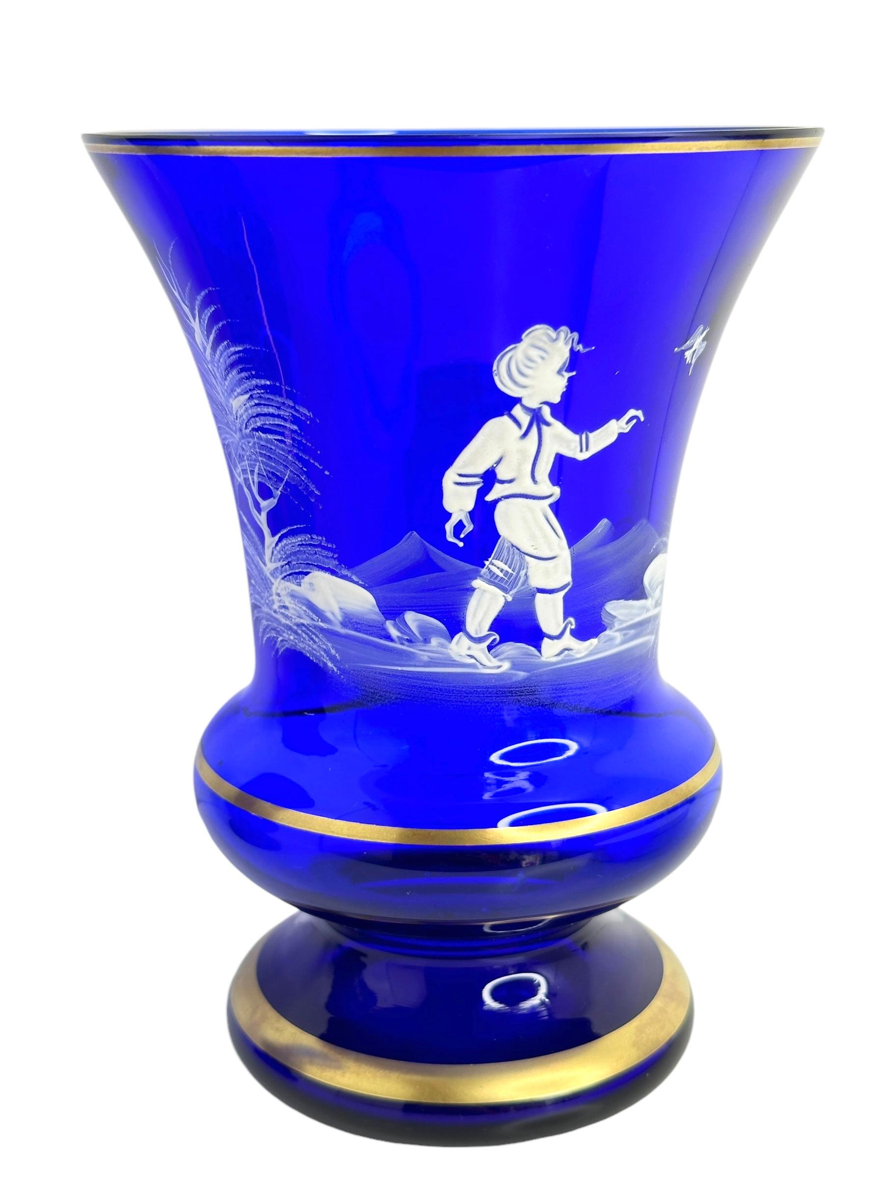Wonderful vintage German glass. This beautiful blue colored and enamel painted glass brings a touch of opulence to any collection of Mary Gregory Glasses. A nice addition to any room or table. Found at an Estate Sale in Nuremberg, Germany.

 