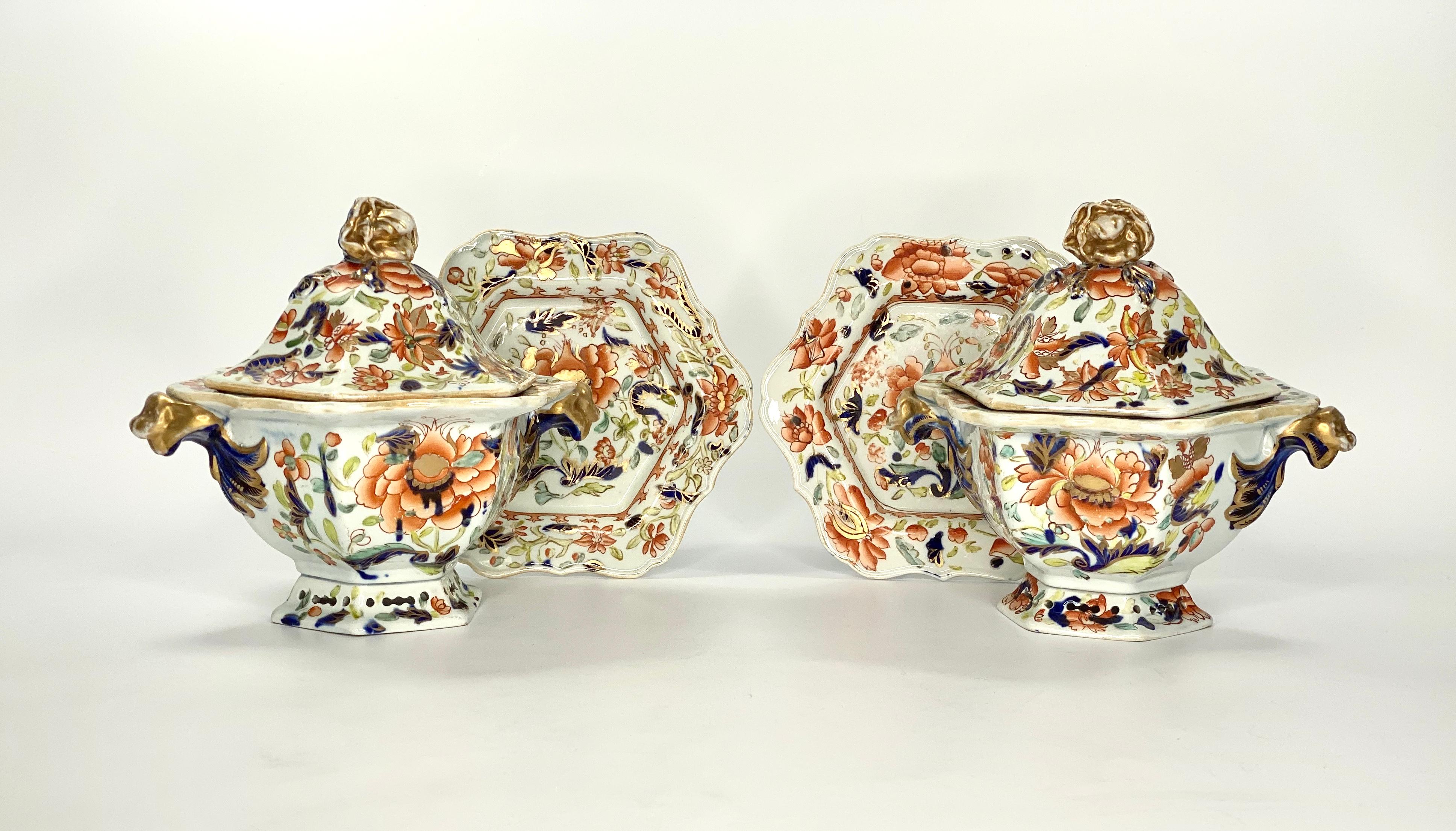 A fine pair of Masons Ironstone sauce tureens, covers and stands, circa 1815. The hexagonal shaped tureens, exuberantly painted in vibrant enamels, underglaze blue and gilding, with flowering plants. Grotesque beast handles, terminating in scroll