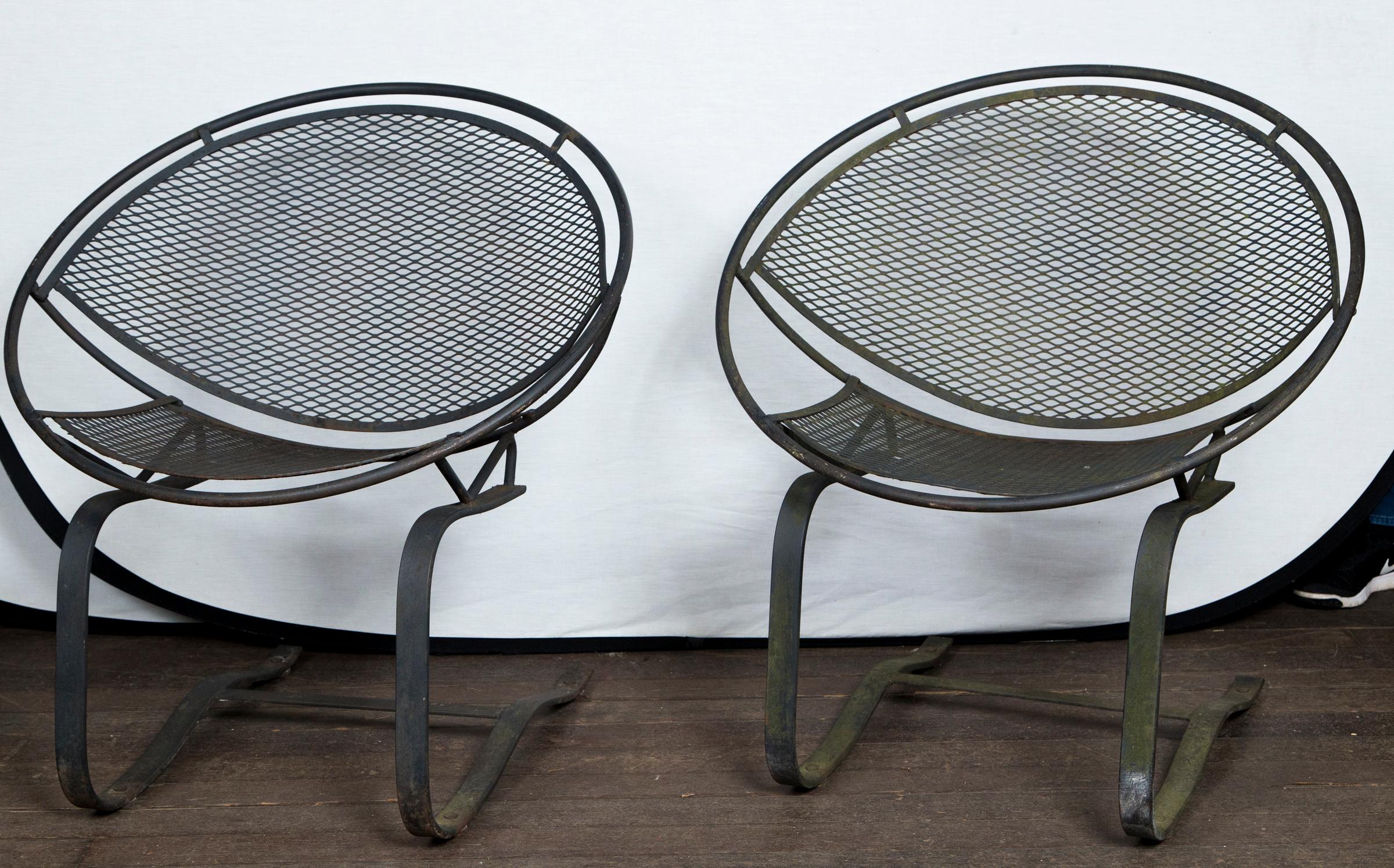 A pair of Maurizio Tempestini for Salterini radar saucer chairs. Hard to find spring version. Mid-Century Modern circa 1950s wrought iron chairs.