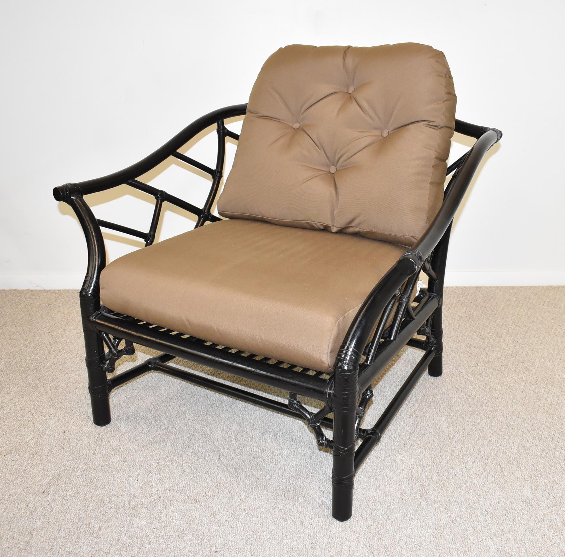 Pair of McGuire Rattan chairs in black, occasional chair's factory black paint, maker's mark, solid construction, very good condition. Dimensions: frame 35