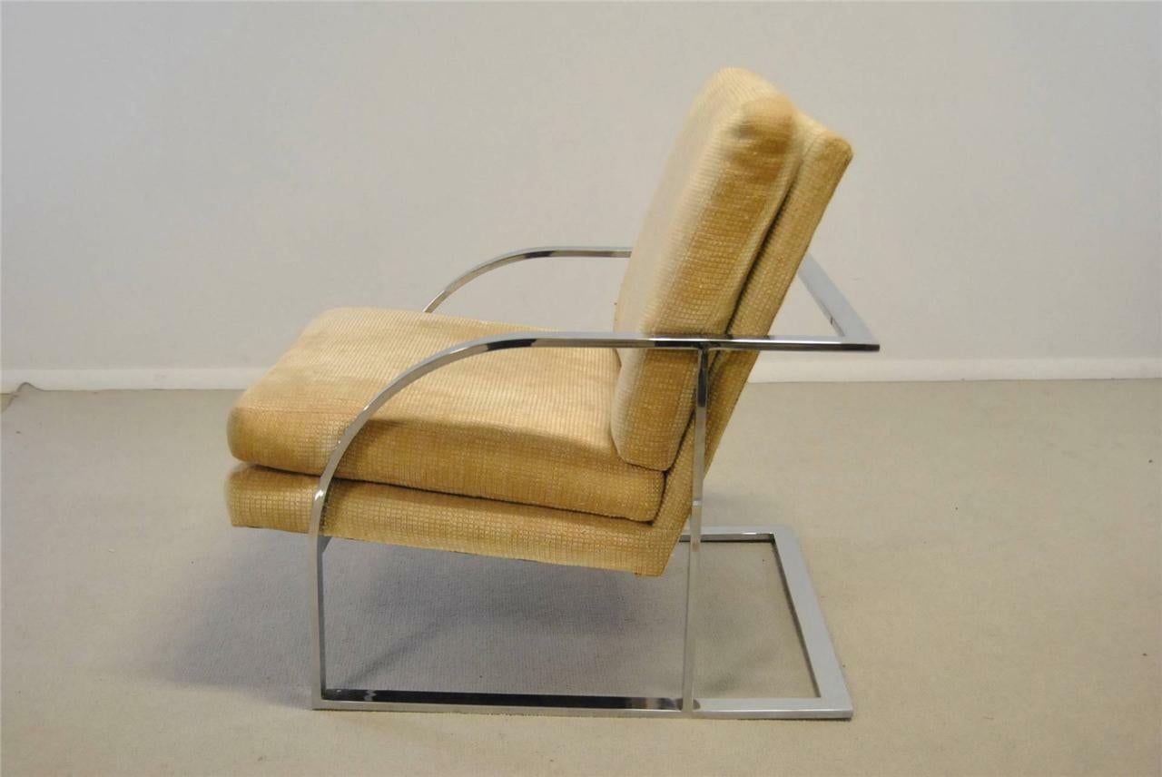 A great pair of midcentury lounge chairs attributed to Milo Baughman. This is a rare set with great lines that feature a heavy flat stock steel frame plated in heavy chrome with rounded arms; chrome is in very good condition with bright sheen. There