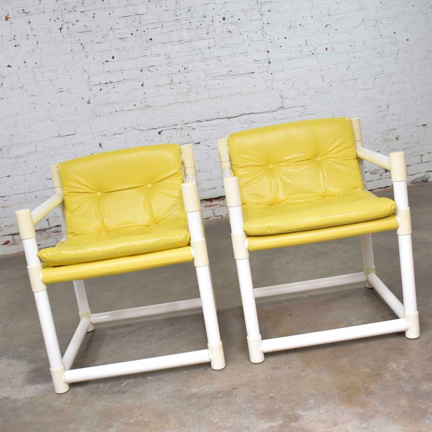 Fun pair of MCM Mid-Century Modern white PVC side chairs with a yellow vinyl upholstery by Decorion Fun Furnishings of Guntown, Mississippi in the style of Jerry Johnson for Landes Manufacturing Co. They are in wonderful vintage condition. There are