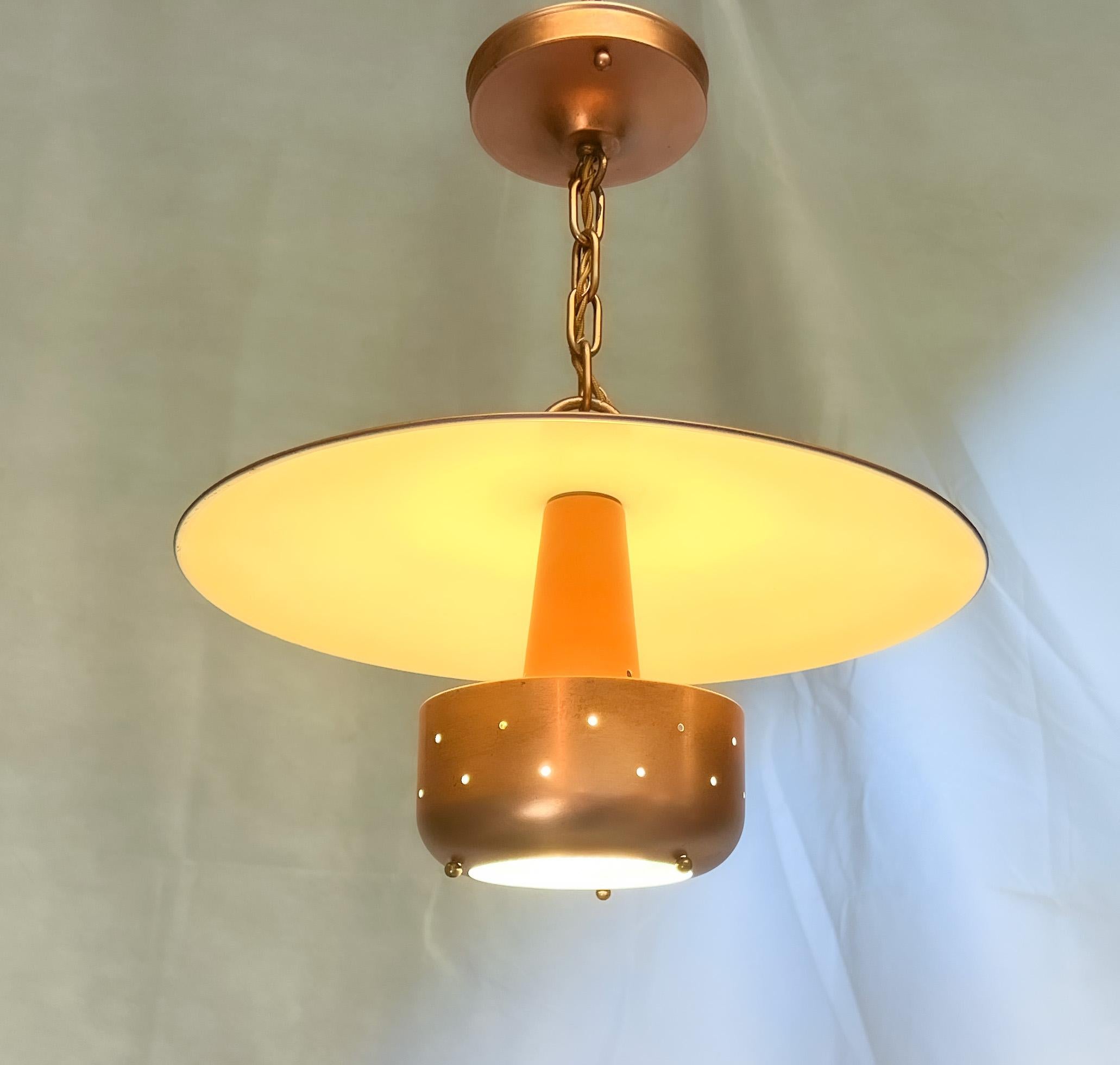 Love these two.
Hero picture is a tad misleading in that the underside of the saucer appears yellow, it is white. It shows that way because it is on/ lit up.
Light is copper painted over brass and steel elements. The fixture is old, but all wiring