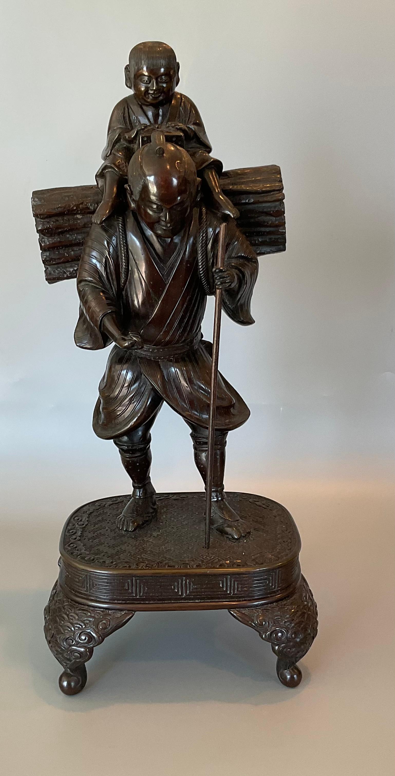 Pair Meiji Period bronze figural hiking family sculptures with incredible detail on the sculptures and on the stand. Incredible original patina. Very well made.