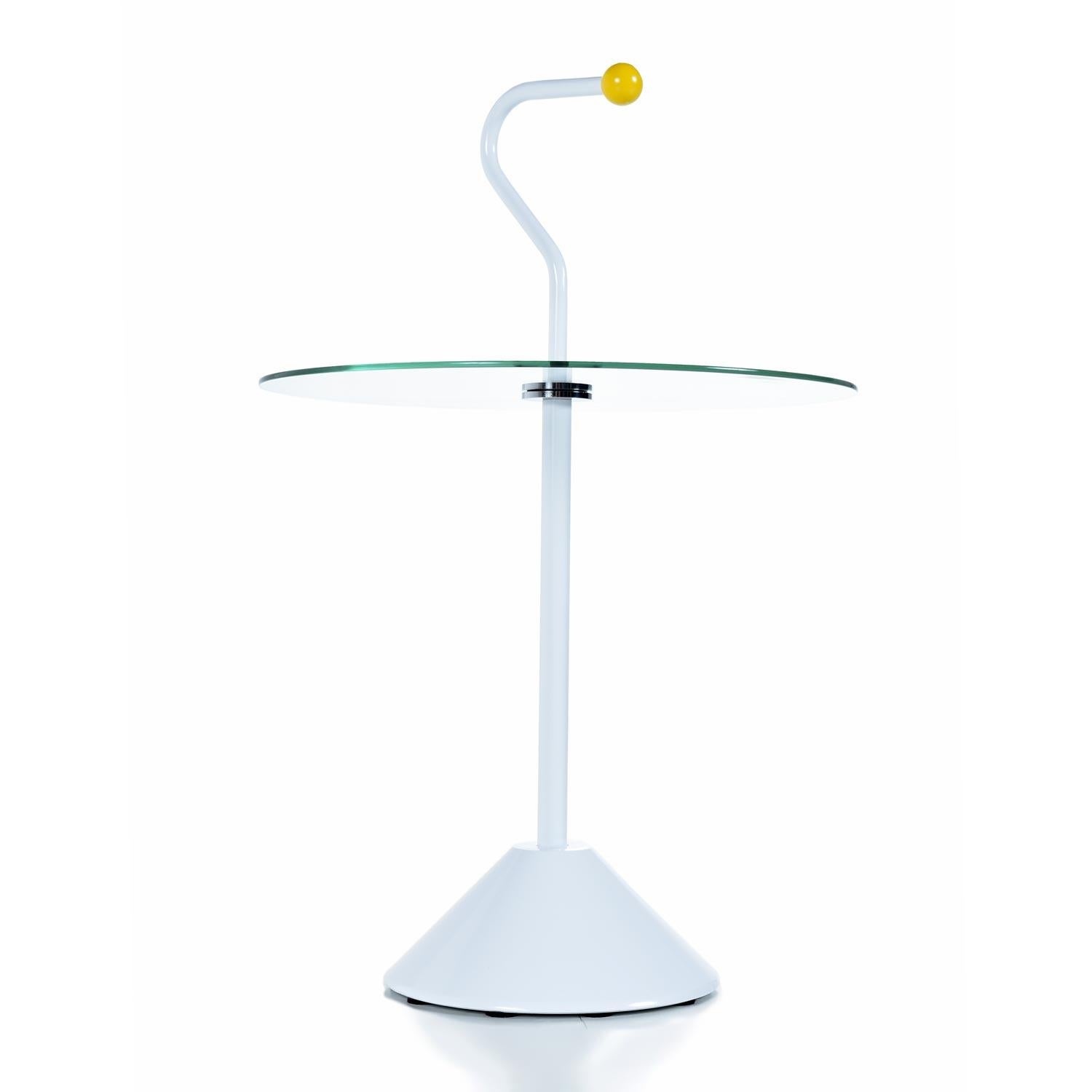 These charming side tables are designed in the whimsical “Memphis” style. Each table is identical. The tables feature a piece of circular glass that appears to levitate on the post. This glass disc serves at the tabletop. The tables are ultra