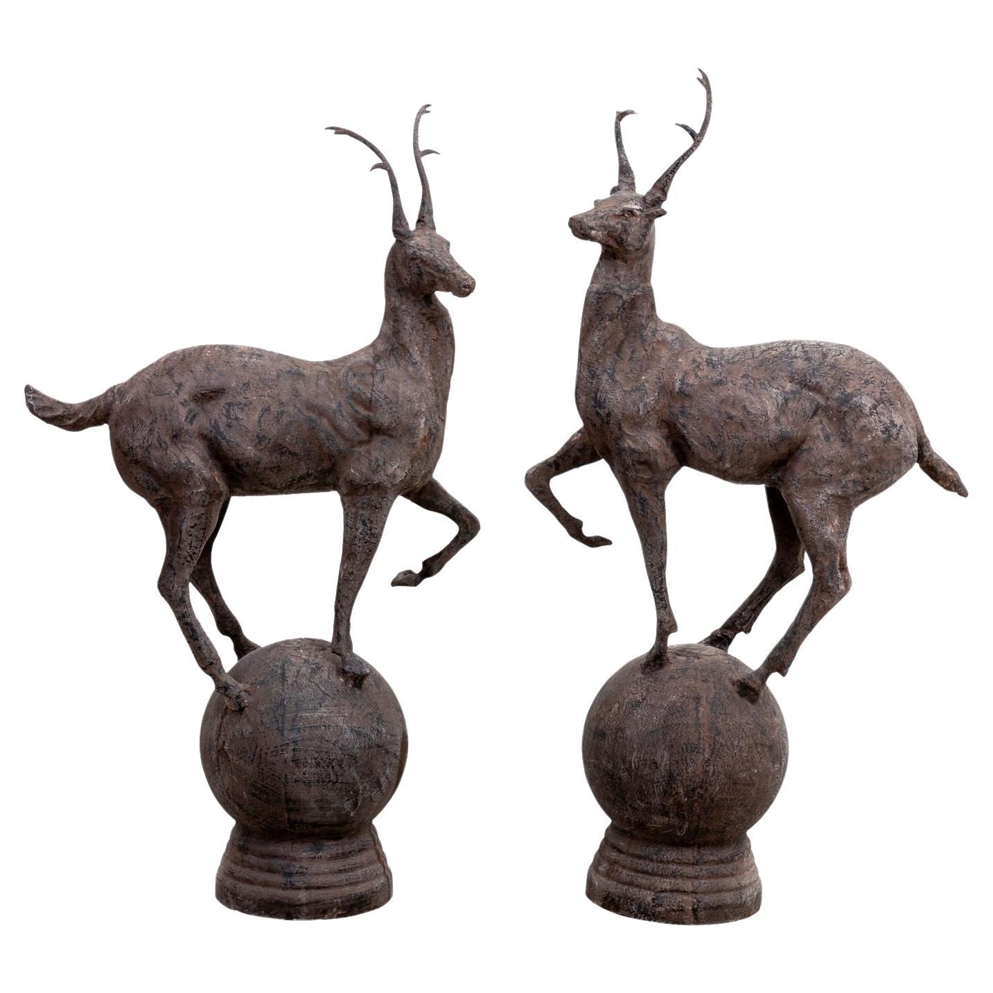 Pair Metal Stags on Globe, late 20th Century