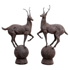 Pair Metal Stags on Globe, late 20th Century