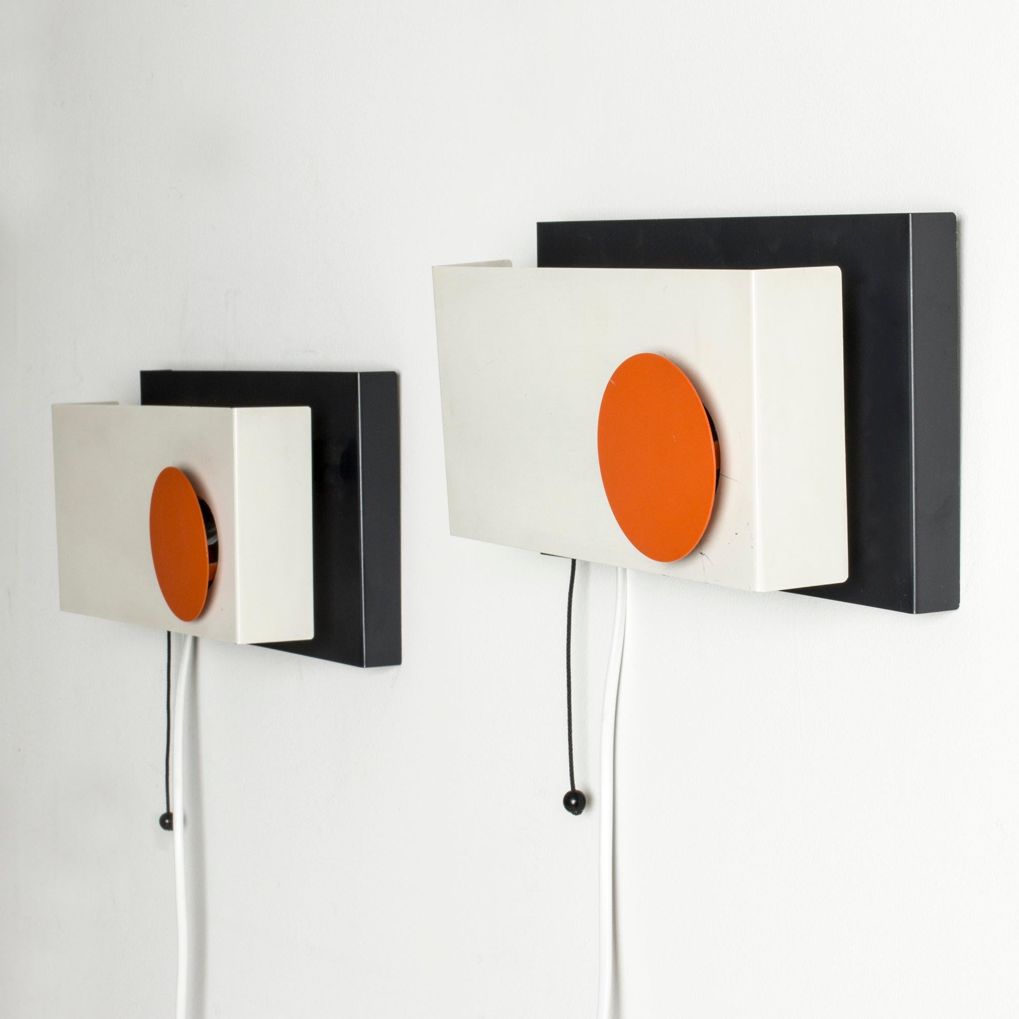 Pair of strikingly graphic wall lights by Sven Aage Holm Sørensen. Made from metal lacquered white, black and orange.