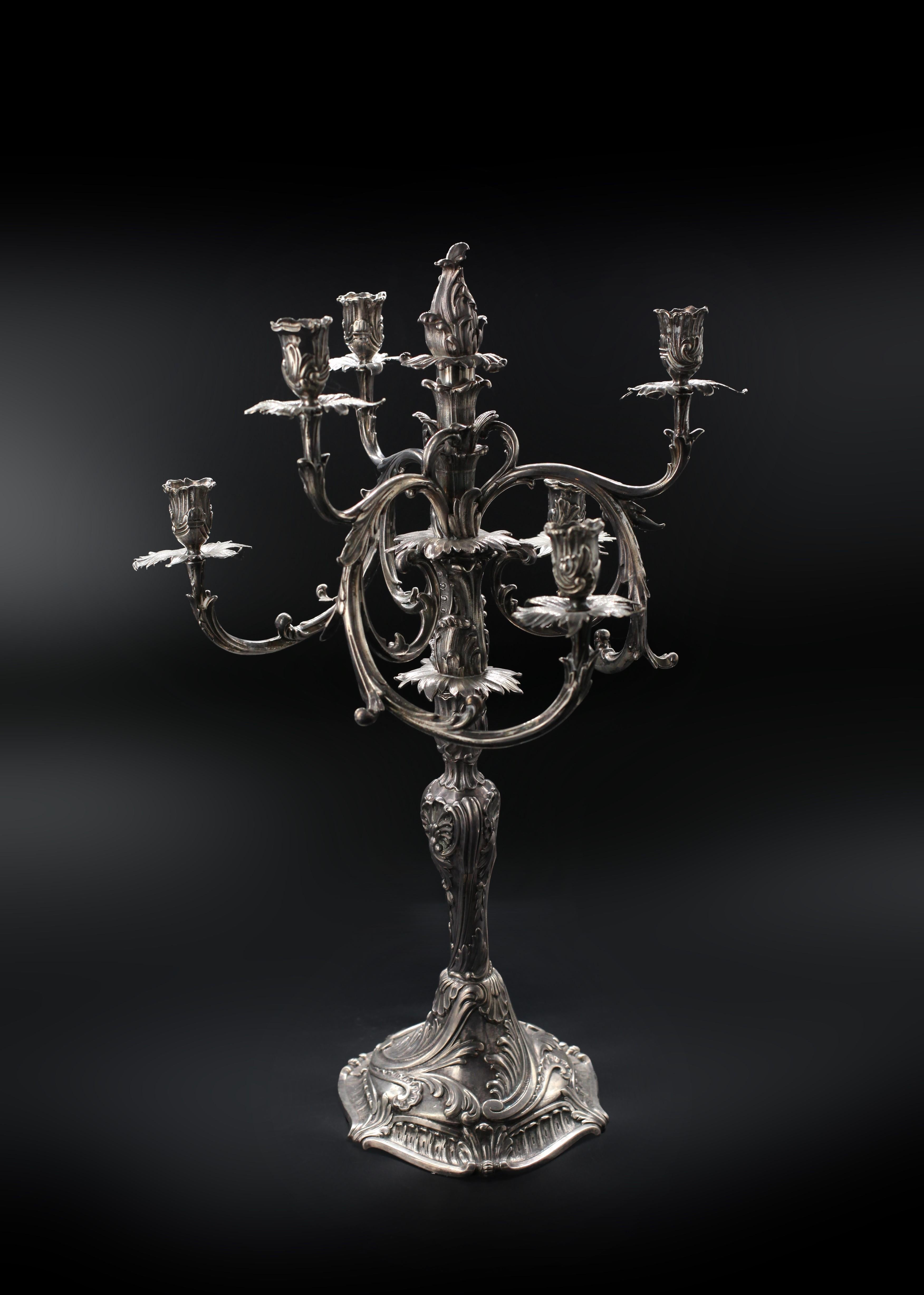 Dip into Rococo reverie and illuminate your surroundings with the dazzling duo of Sterling Candelabras by Anton Michelsen. With their every Rococo-inspired detail, they stand as silent heralds of Christian F. Heise's era, serving as both a light