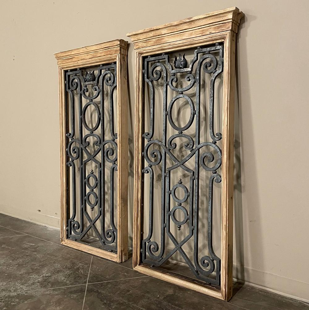 Pair mid-19th century French hand-forged wrought iron framed panels were painstakingly crafted by an obviously talented metal smith out of red-hot iron to create an artistic window accent that also happens to be exceedingly secure! Hand-forged