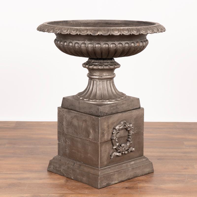 Pair, Mid-20th Century Cast Iron Planting Urns Resting on Square Plinth For Sale 1