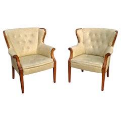 Pair Mid 20th Century Mahogany and Tufted Vinyl Upholstered Wingback Chairs