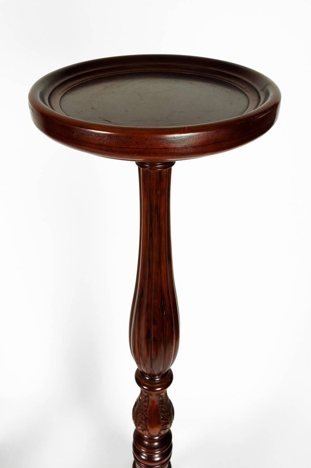 Pair of dark mahogany wood, mid-20th century plant stand / ferns / pedestals tables. Each fern / stand is in excellent condition. Each one measures about 51 inches high and 12 inches top diameter.
 