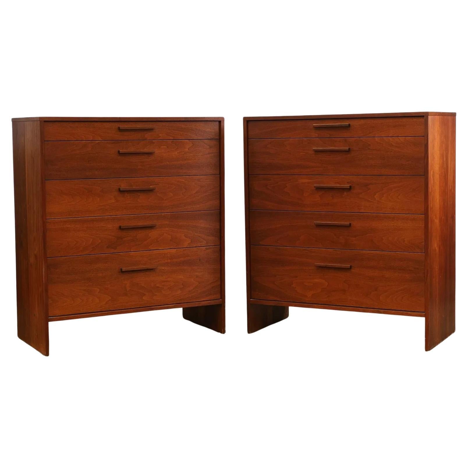 Beautiful Pair of American studio craft Mid Century Modern black walnut dressers with 5 drawers all solid carved walnut pull handles. Solid oak drawer construction. Great symmetrical design in good vintage condition with stunning walnut grain. Rare