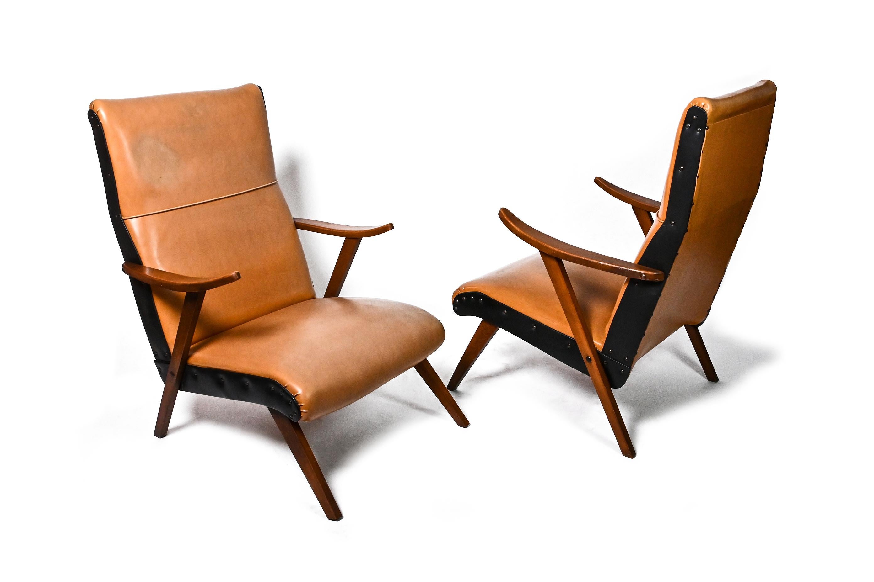 pair of midcentury armchairs. Poland. 1960s. Wood. Vinyl.