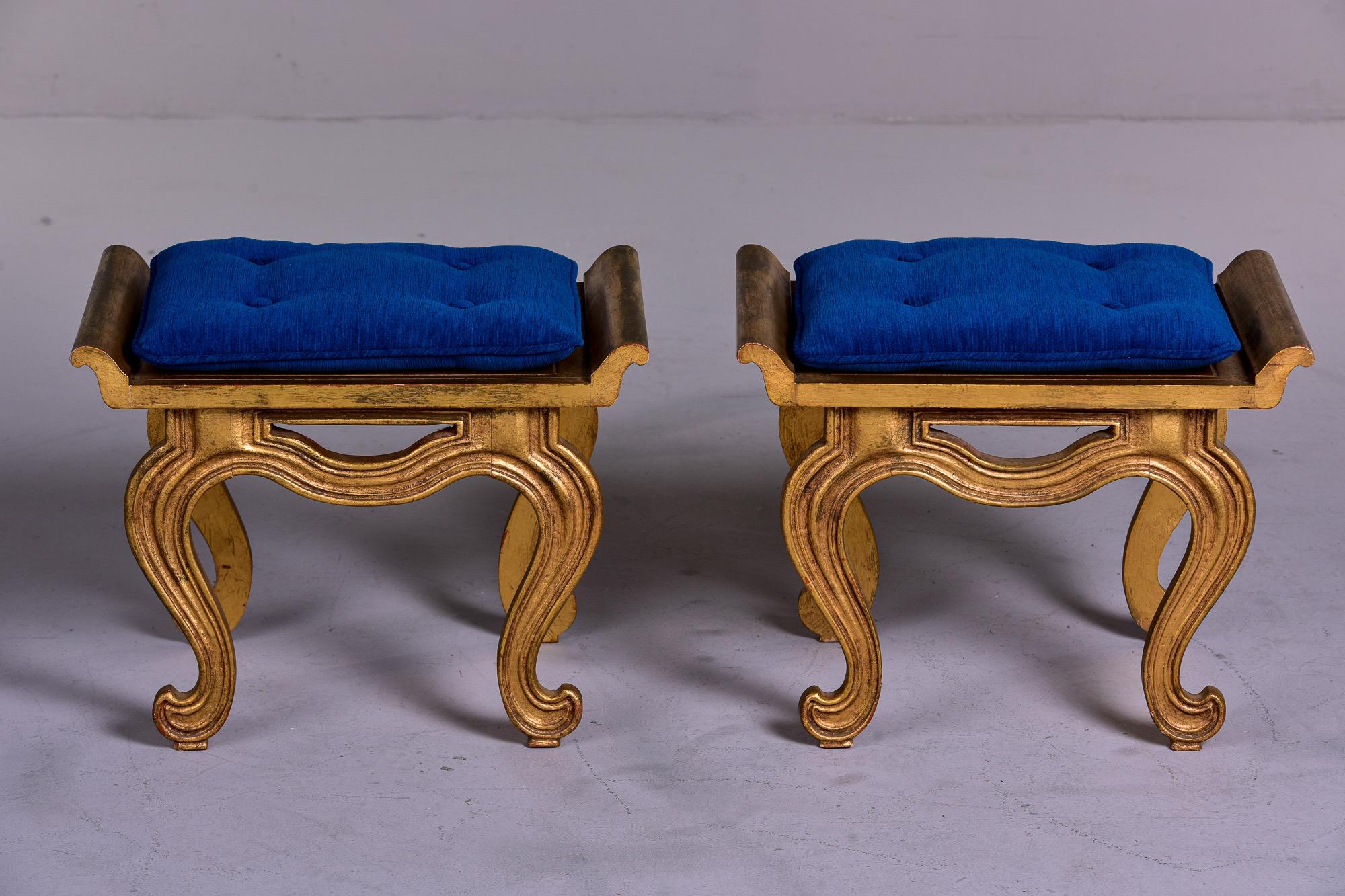 Circa 1960s pair of Asian style wood stools or side tables with gilded finish. We had removable tufted cushions made in peacock blue chenille velvet. Unknown maker. Found in the US. Sold and priced as a pair. 

Seat height: 14” without cushions -