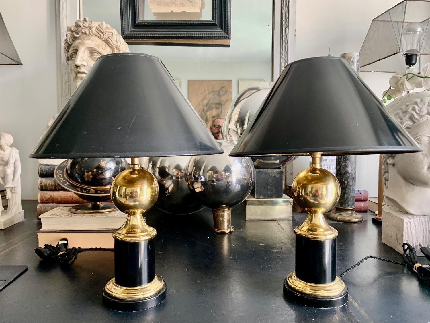 A nice pair of table lamps, from the 60s, in the style of the French house Maison Charles, the lamps are made of gilded brass and lacquered metal, they are in good condition and have been rewired to adapt them to current use, the lamp shades in