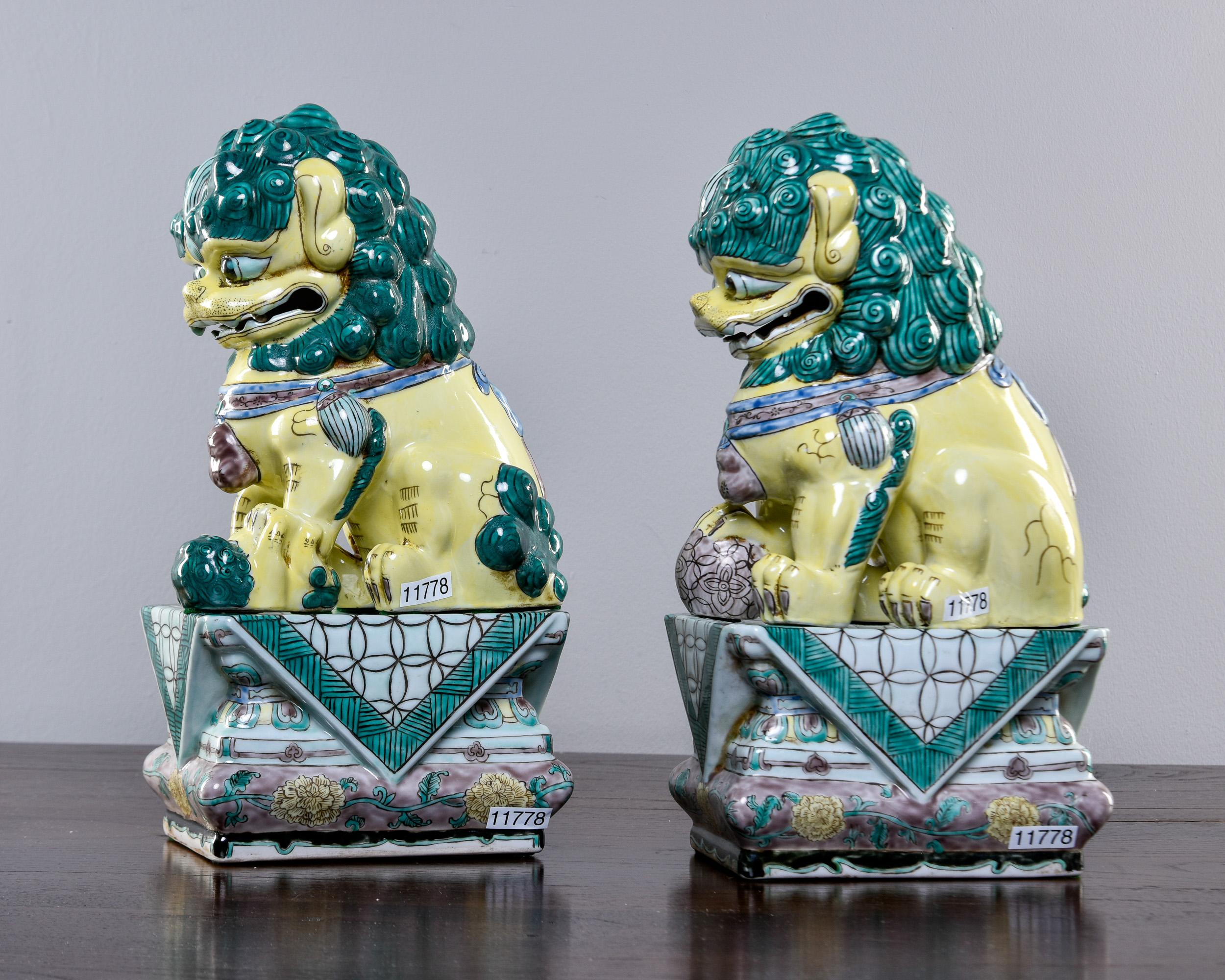 Chinese Pair Mid Century Ceramic Foo Dogs on Base For Sale