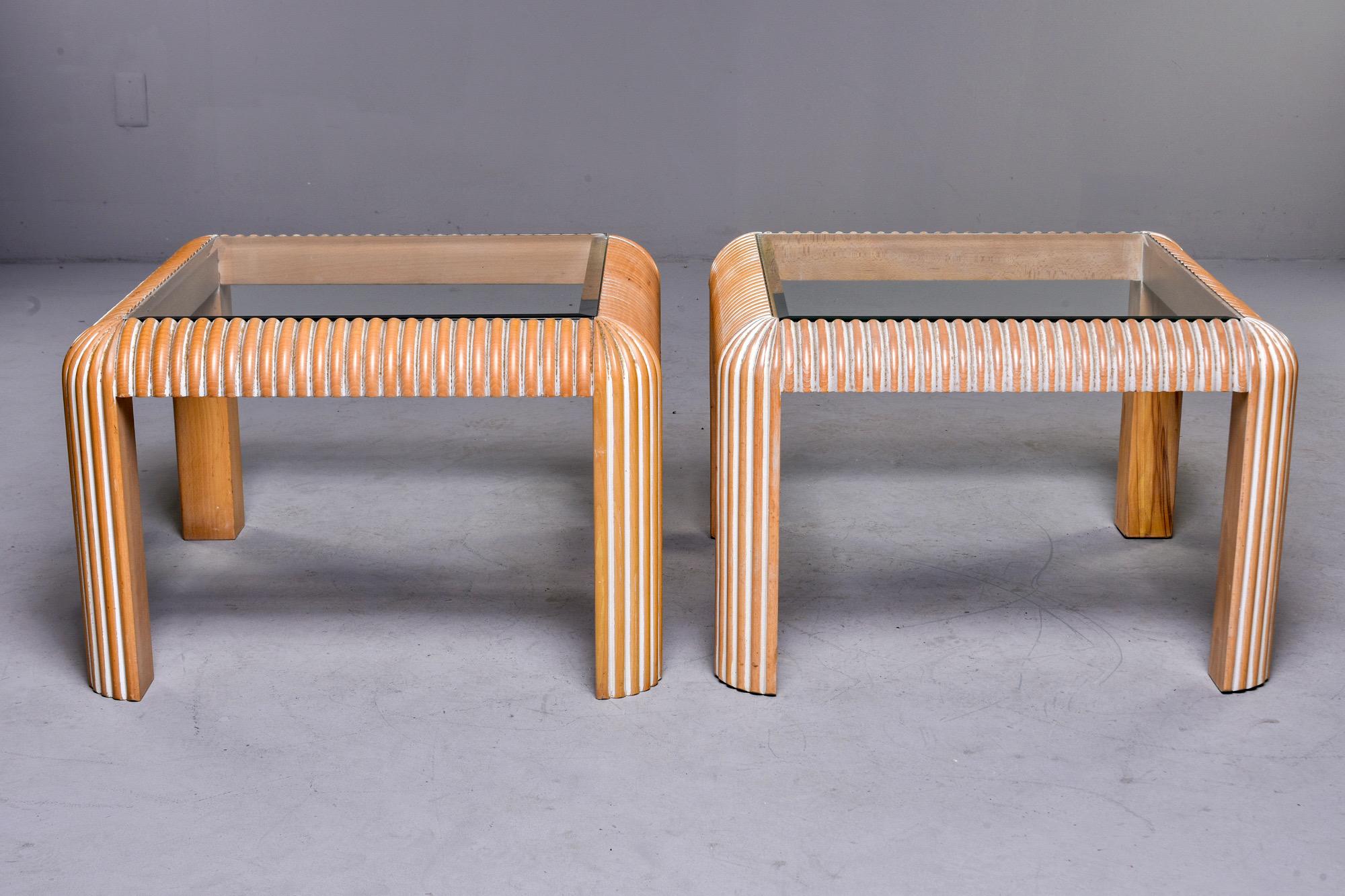 Pair of side tables found in England with a reeded surface and cerused ash base and beveled edge glass tops, circa early 1980s. Unknown maker. Sold and priced as a pair.
 