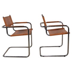 Pair Mid century chrome tan leather Mart stam B34 dining arm chairs