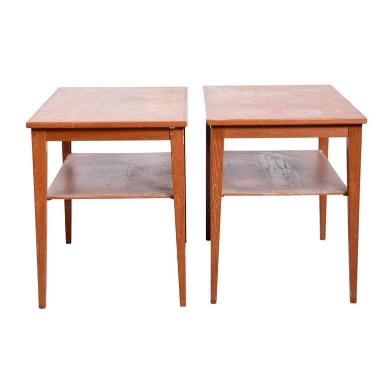 Pair of mid century danish modern by Thams Kvalitet Function Form Danish Modern 2-tier side tables, tapered legs with lower shelf. Can be used and end tables or nightstands. Good vintage condition. Located in Brooklyn NYC.

Each table Measures 21