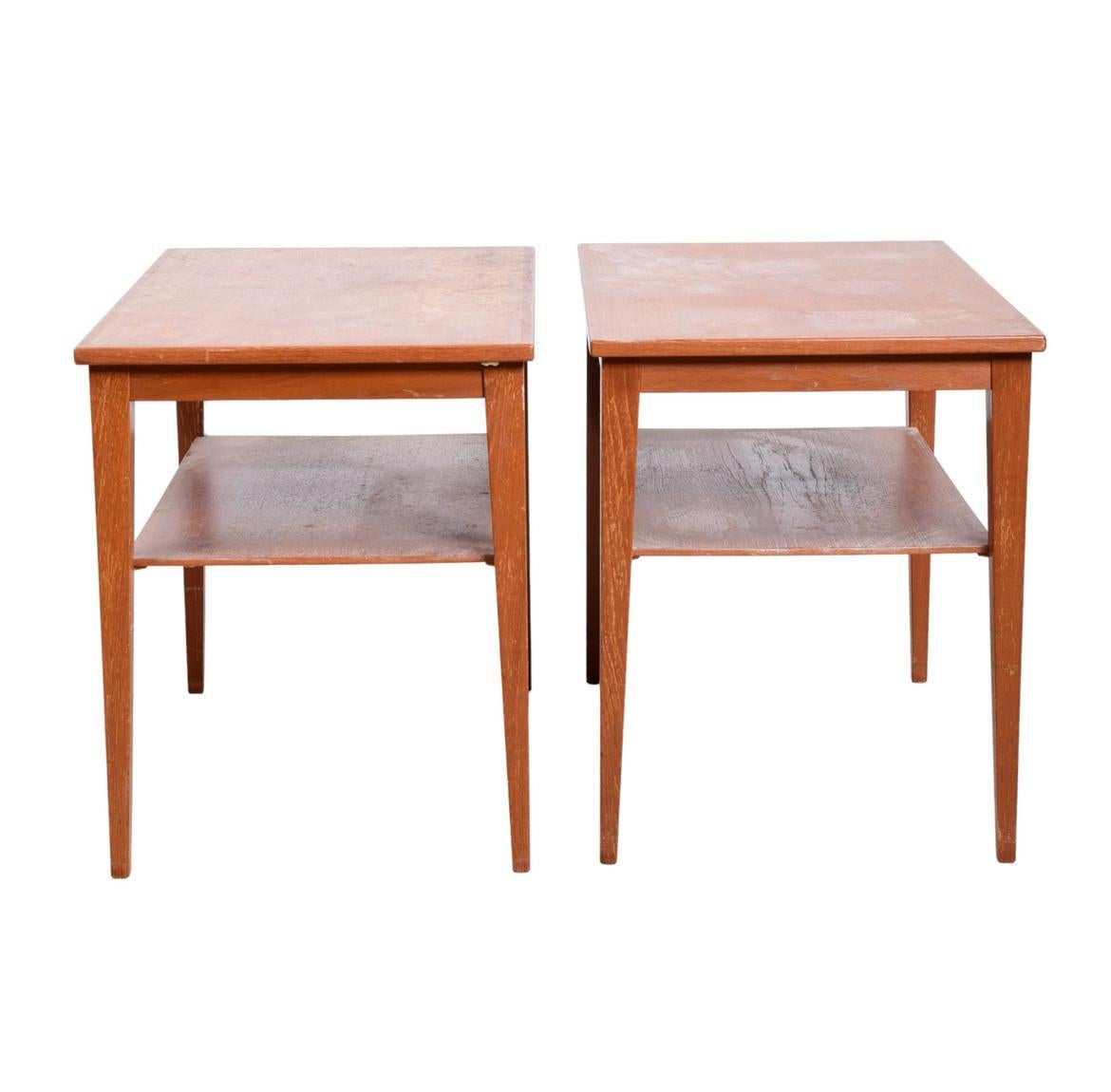 Pair of mid century danish modern by Thams Kvalitet Function Form Danish Modern 2-tier side tables, tapered legs with lower shelf. Can be used and end tables or nightstands. Good vintage condition. Located in Brooklyn NYC.

Each table Measures 21