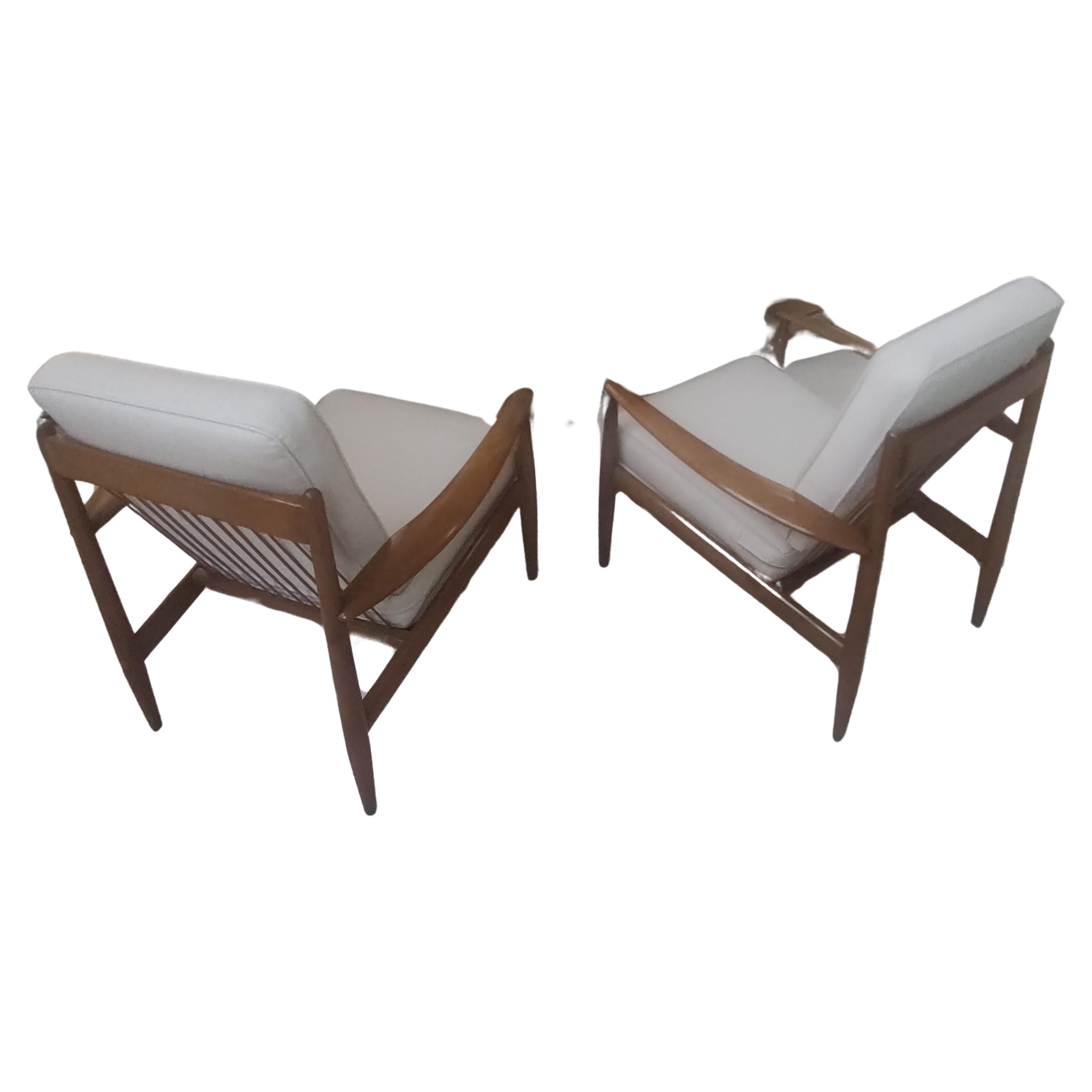 Fabulous pair of Beech Mid Century Danish Modern Lounge Chairs by Grete Jalk for John Stuart. Cushions are fairly new and in excellent condition with very little wear. Wood frames were well taken care of and in near mint condition, very little wear