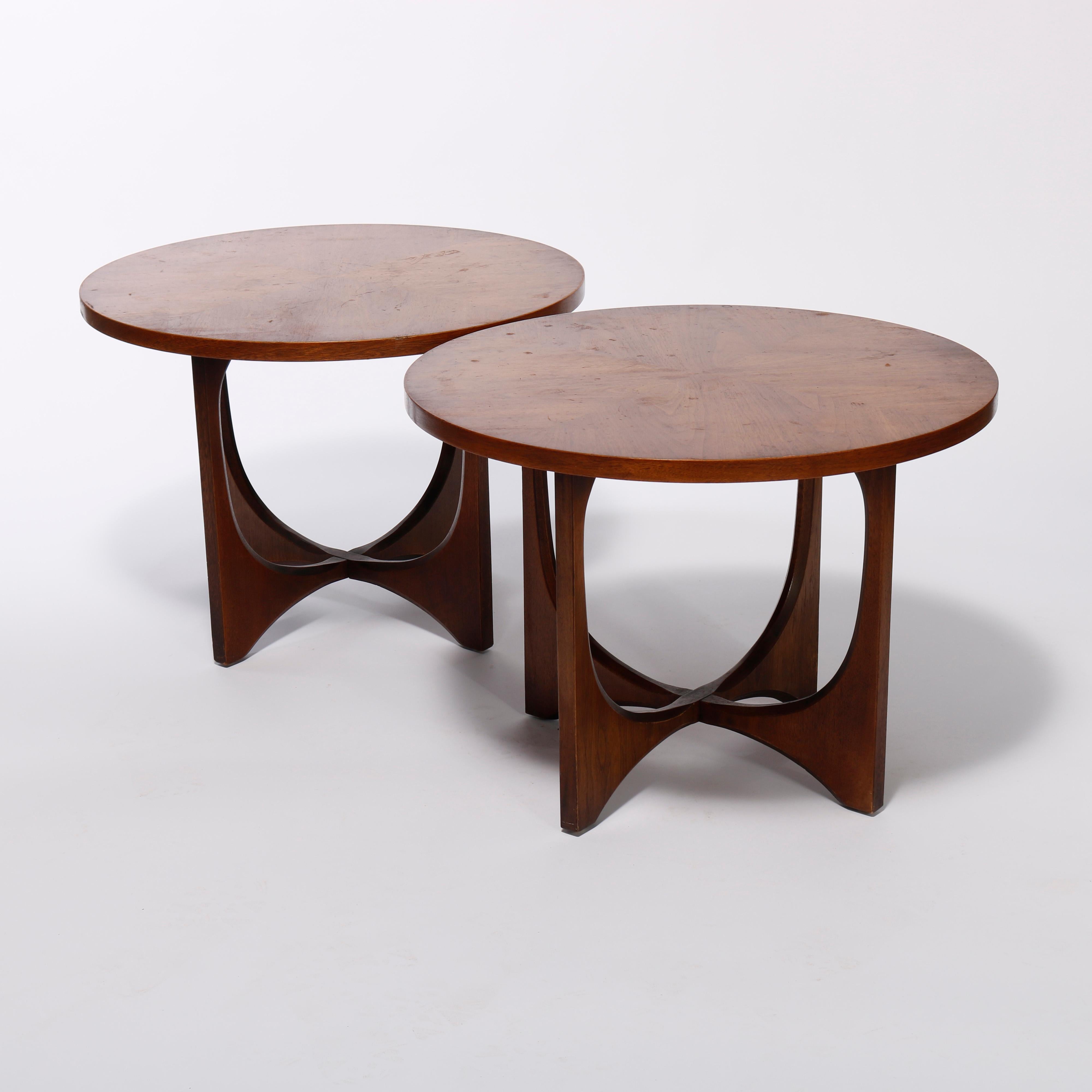 A pair of Mid-Century Danish Modern side tables offer walnut construction with circular and bookmatched tops over four open legs, c1960

Measures- 20.5'' H X 28'' W X 28'' D.