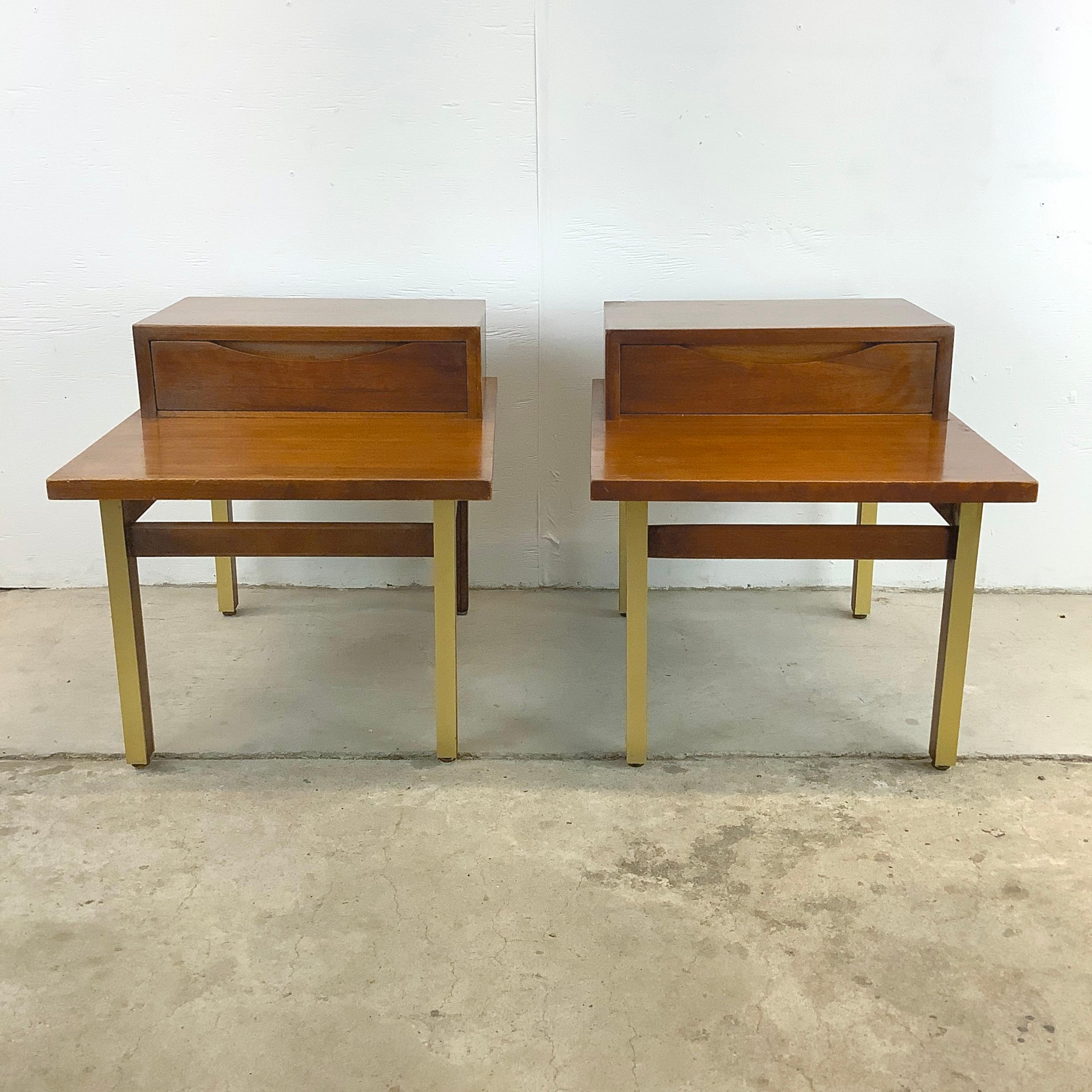 Enjoy the timeless allure of mid-century modern design with this exquisite pair of Mid-Century Modern Step Side Tables/Nightstands by American of Martinsville. These tables aren't just functional pieces; they're a window into an era where form and