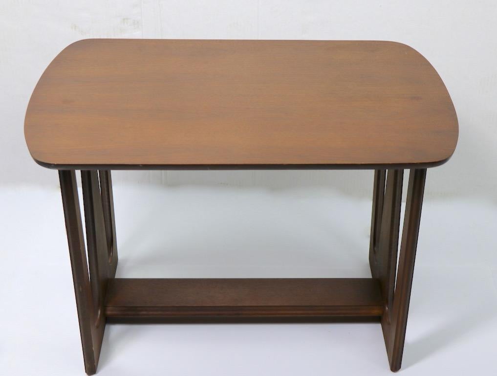 Stylish pair of Mid-Century Modern end tables, both are clean and ready to use, showing only minor cosmetic wer, normal and consistent with age. Design reminiscent of the Brasilia line for Broyhill. Priced and offered as a pair.