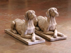 Pair Mid-Century English Patinated Cast Stone Recumbent Hounds on Plinth Bases