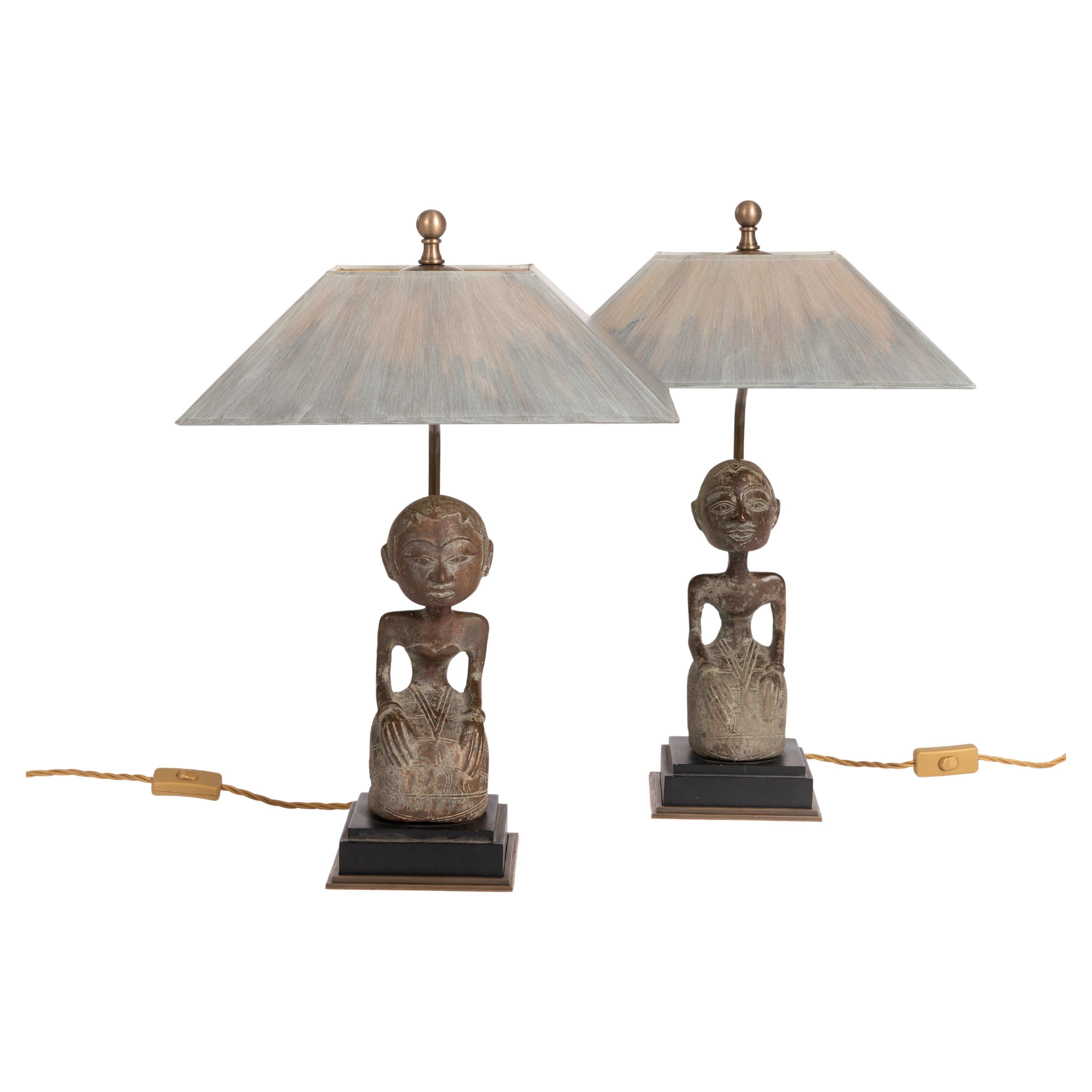Mid-Century Asian bronze sculptures as a sitting couple from the island of Bali as figural table lamps.

These statuettes are usually given to the couple as a wedding gift. 
Bride and groom in stile position.
Fine bronze casting with valuable